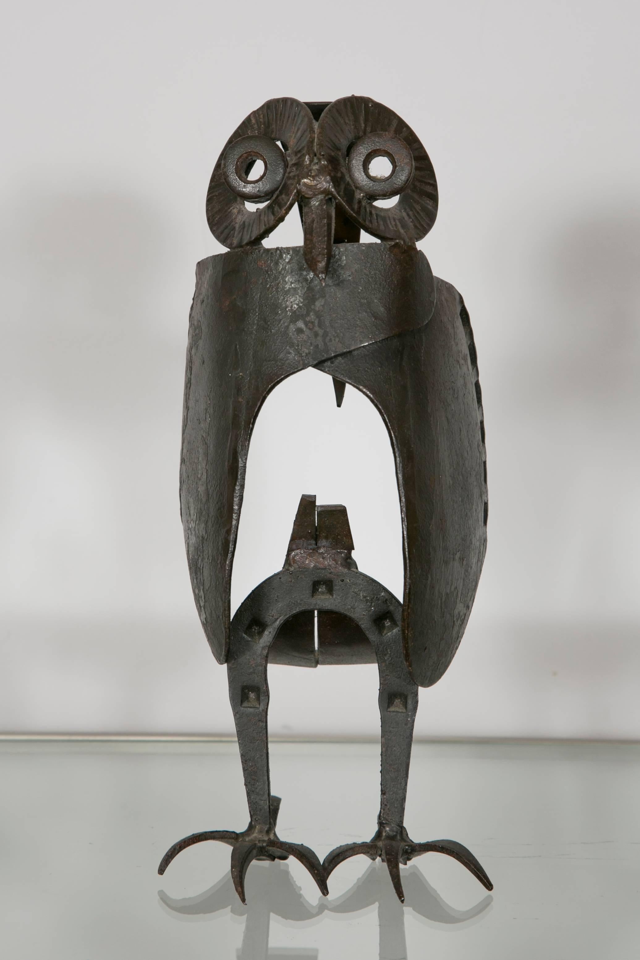 A wrought iron sculpture of an owl made in recycled iron tools or objects (like horse shoes, nails etc...).
Signed by artist initials: M.L.
France, circa 1960.