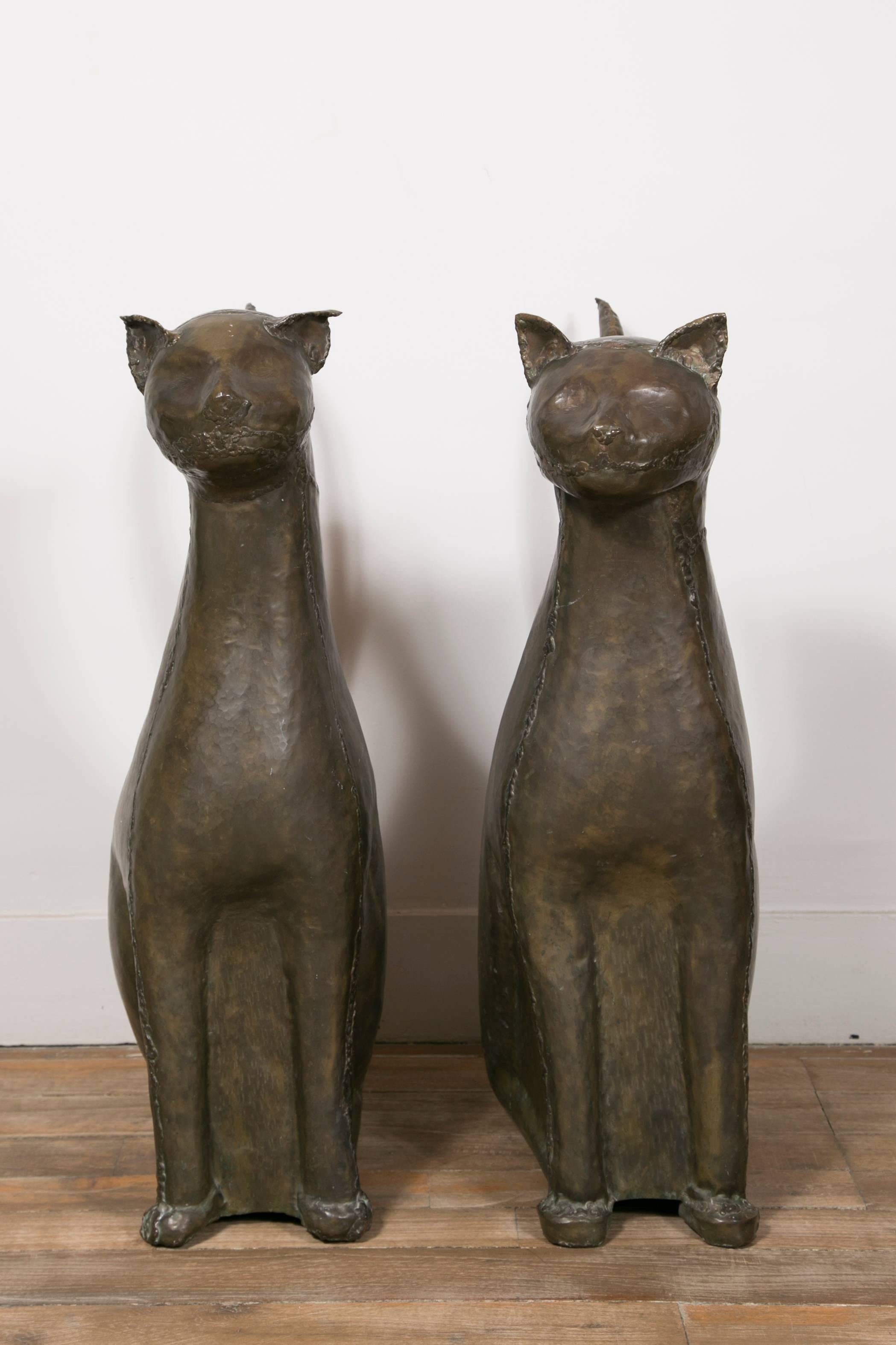 A large pair of Egyptian style cats made of hammered copper with dark patina.
These cats are inspired by images of the Cat Goddess Bastet
France, circa 1960.