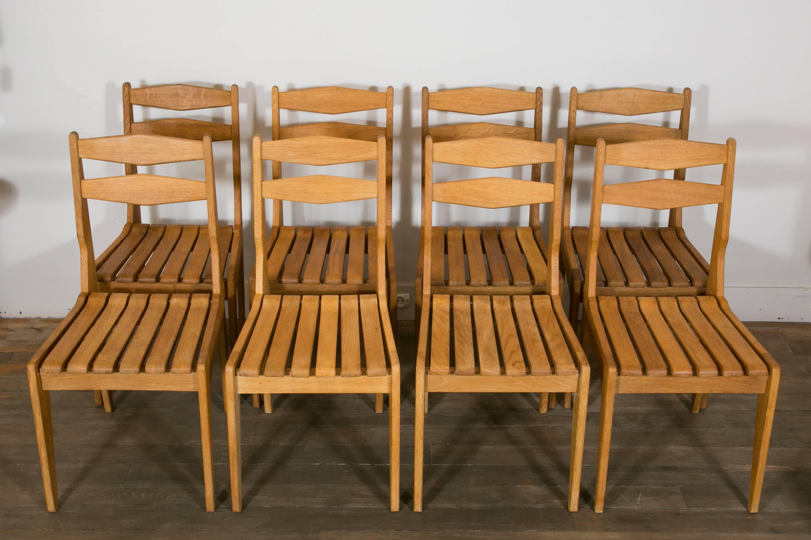 Set of eight chairs in solid light oak.
Designers: Roger Guillerme et Jacques Chambron.
Edition Votre Maison
France, 1960s.