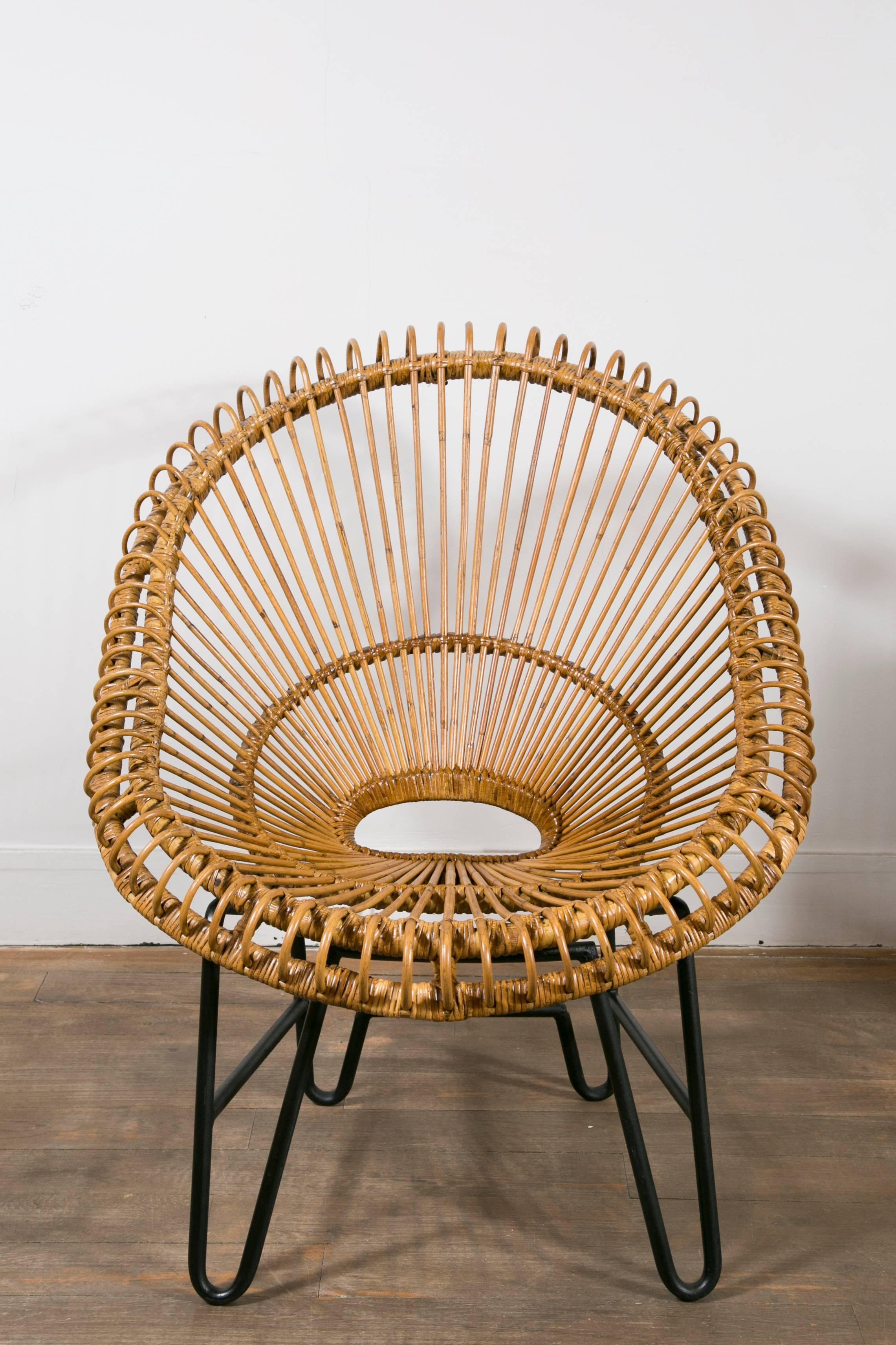 Rattan and bamboo set of four scoop chairs and one table
In the style of Janine Abraham
Lacquered metal feet
The table is sold with a glass top ( not showed on photos )
France, 1960s

Chairs dimensions
Height 33.8 in. (86 cm)
Width 29.5 in.