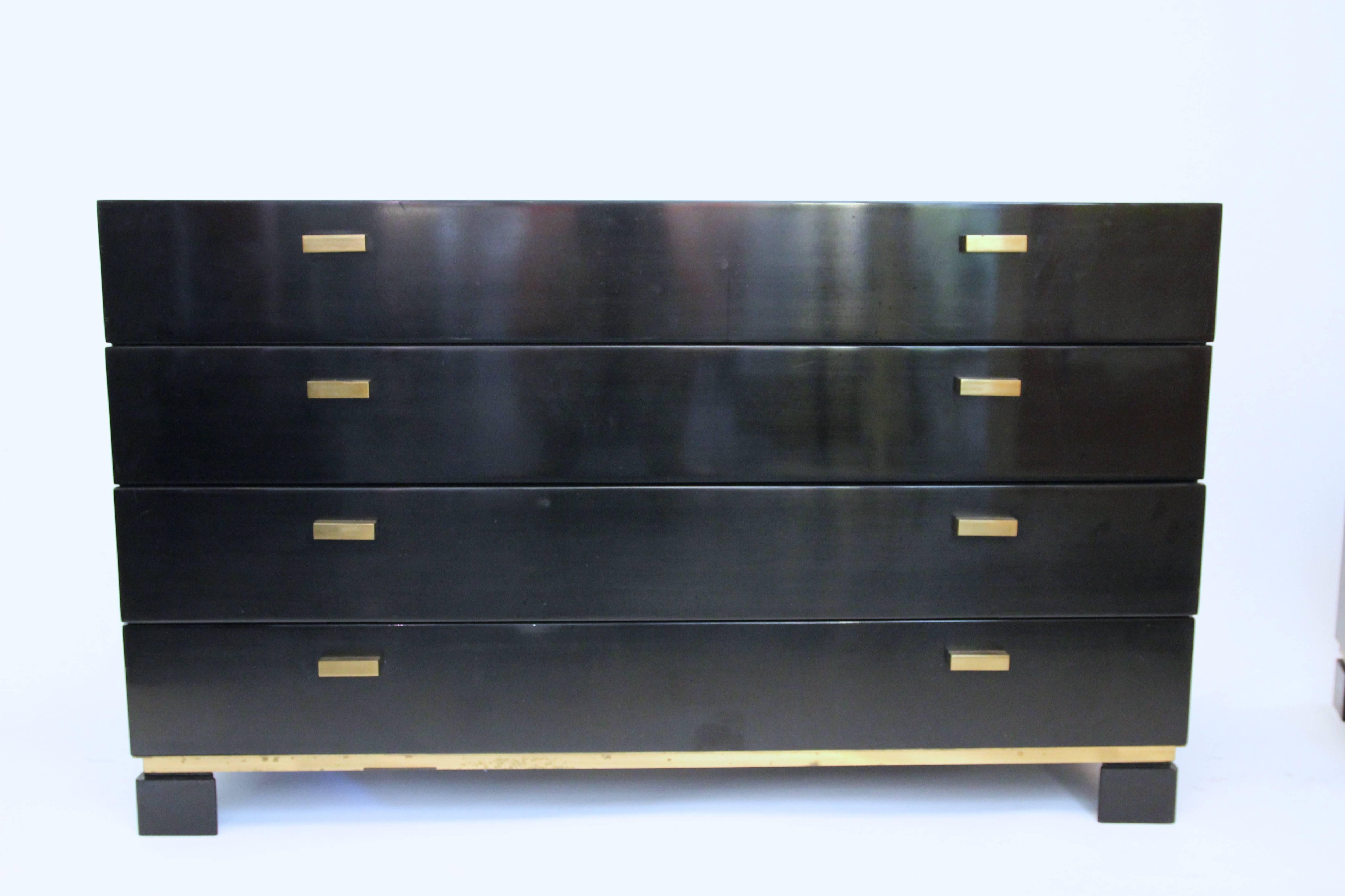 Sideboard and pair of drawers,
lacquered wood and gilt brass,
circa 1970, France.
Measures: Sideboard: Height: 66 cm, width: 110 cm, depth: 50 cm.
Drawers: Height: 39 cm, width: 58 cm, depth: 34 cm.