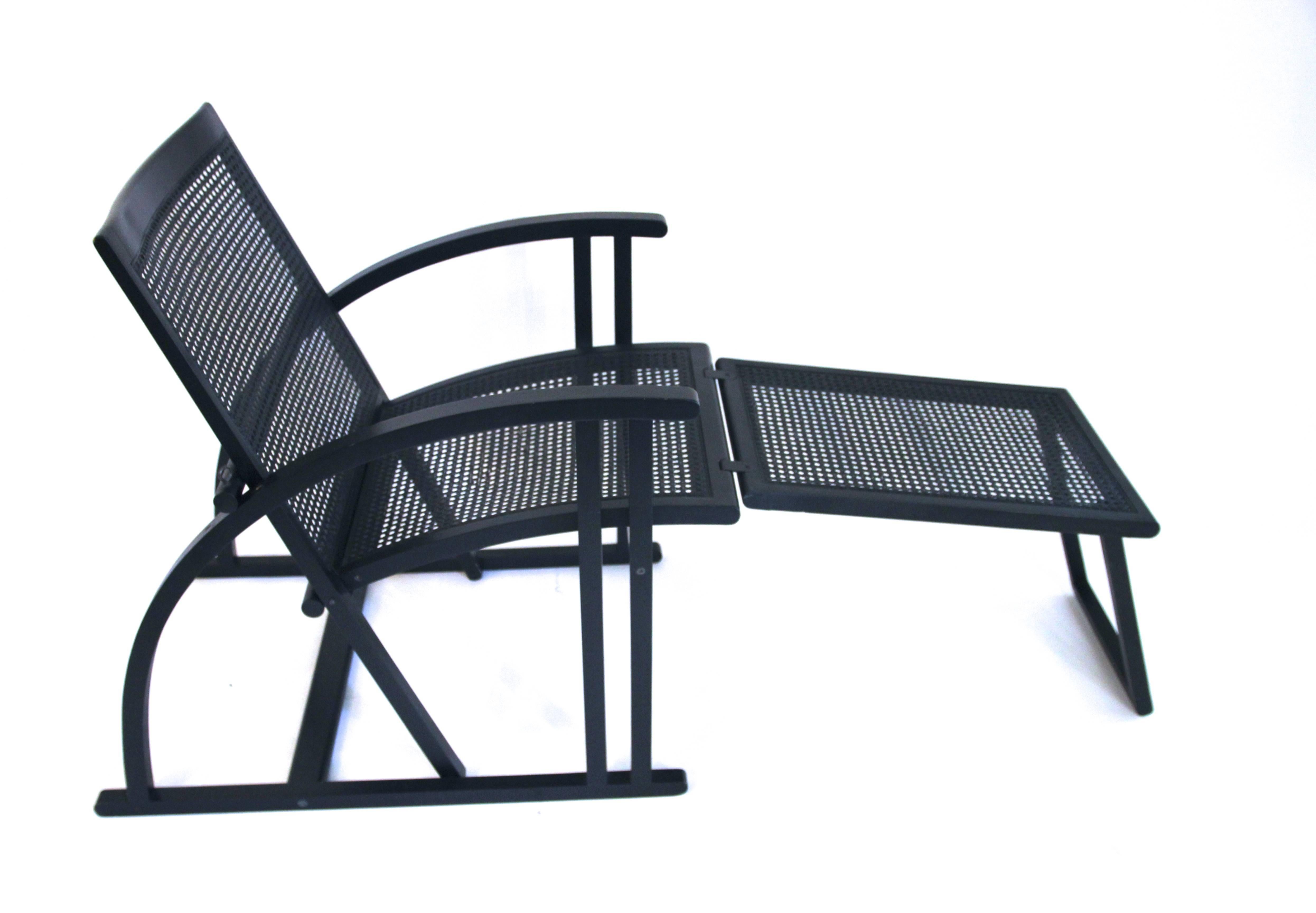 Pascal Mourgue, armchair with its footrest,
Model ARC, edition Pamco Triconfort,
Black wood and rattan,
circa 1983, France.
Measures: Height: 80 cm, seat height: 45 cm, width: 58 cm, depth: 80 cm,
footrest: height: 45 cm, width: 37 cm, depth: