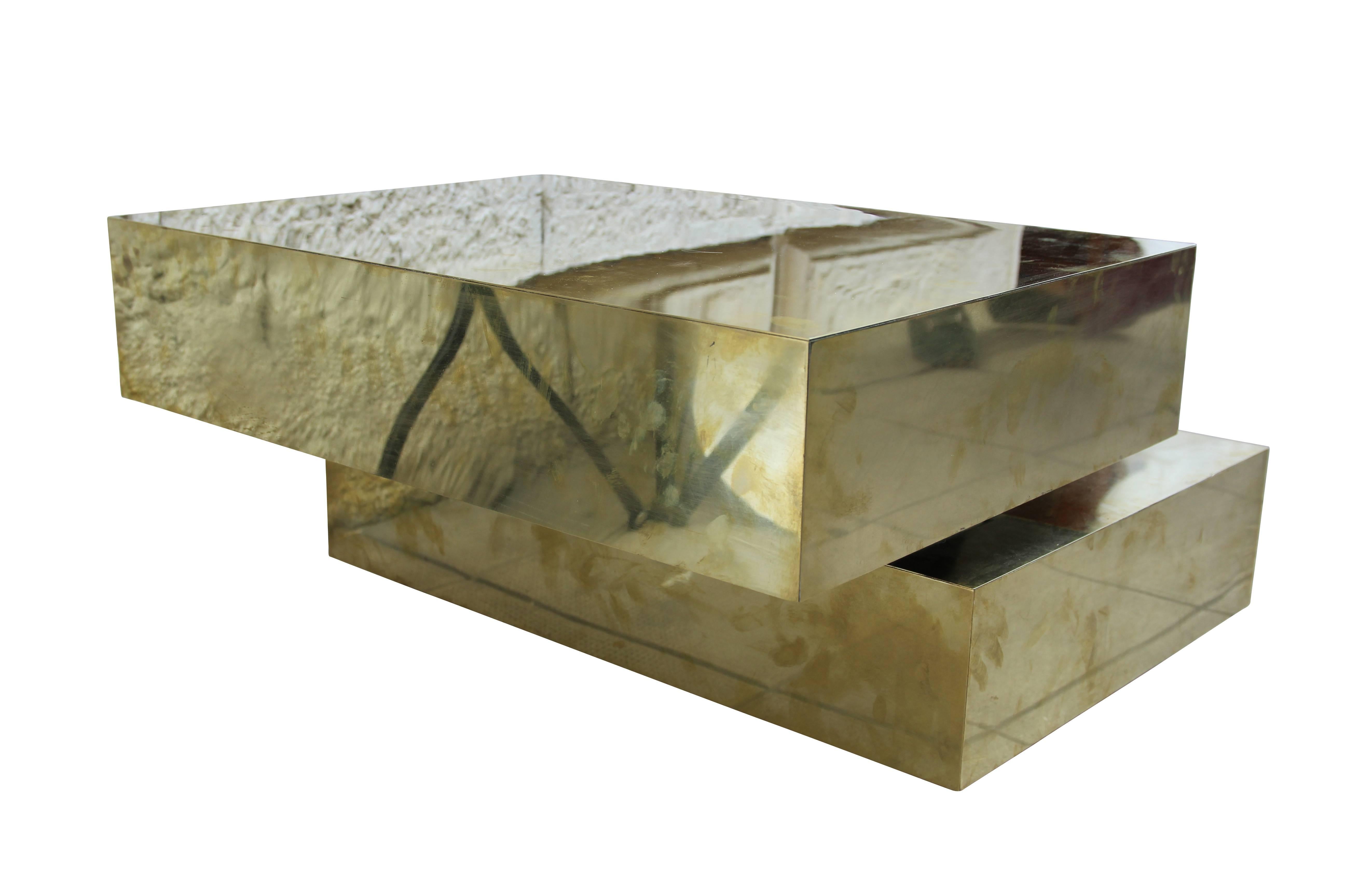Coffee table by Gabriella Crespi, 
Sculpture Model,
Wooden structure covered with golden brass,
Mechanism metal which toggles the upper part,
Engraved signature, Italy, circa 1970.
Measures: Coffee table height: 40 cm. 
Cube height: 15 cm,