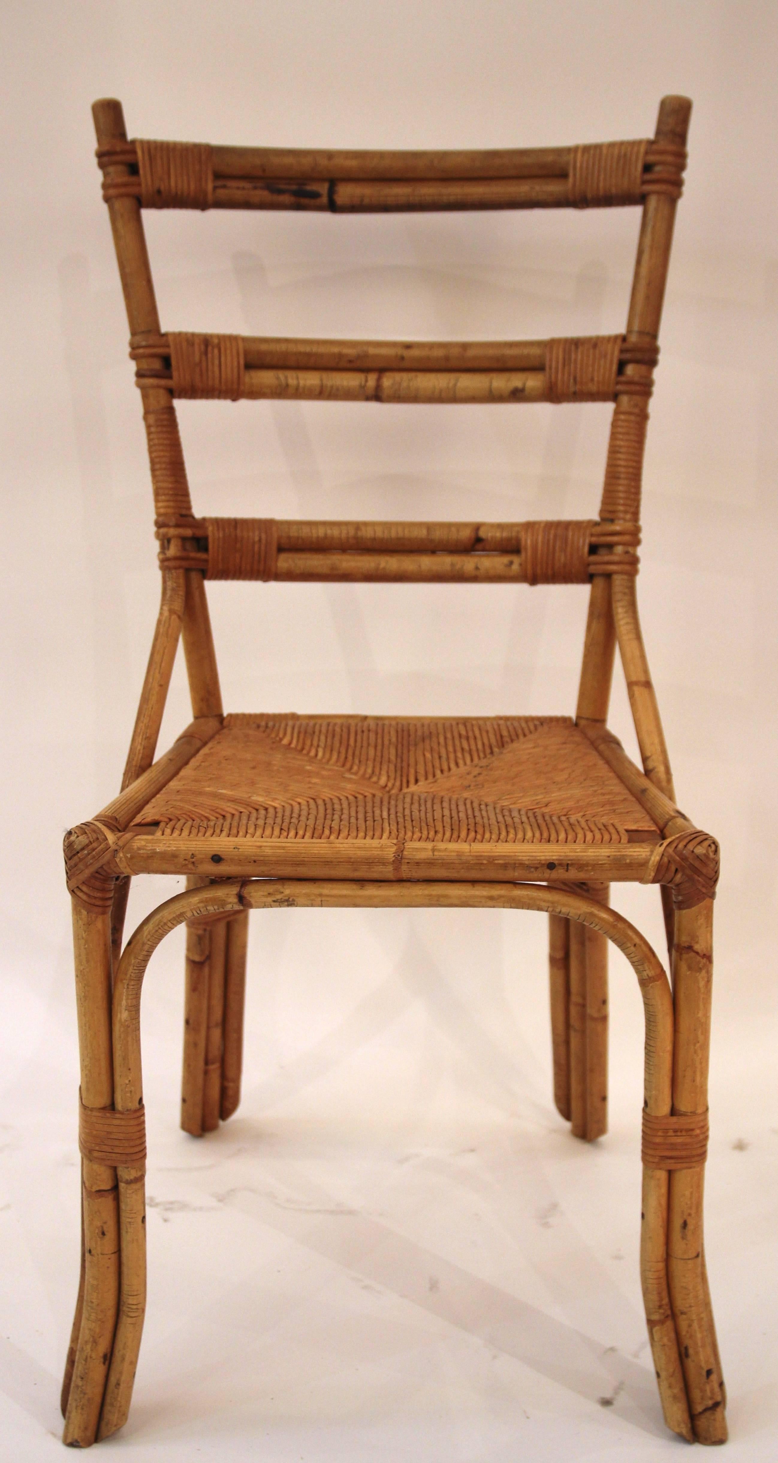 Set of six chairs in the style of Audoux-Minet, 
rattan,
circa 1970, France.
Height: 92 cm, seat height: 45 cm, width: 40 cm, depth: 40 cm.
