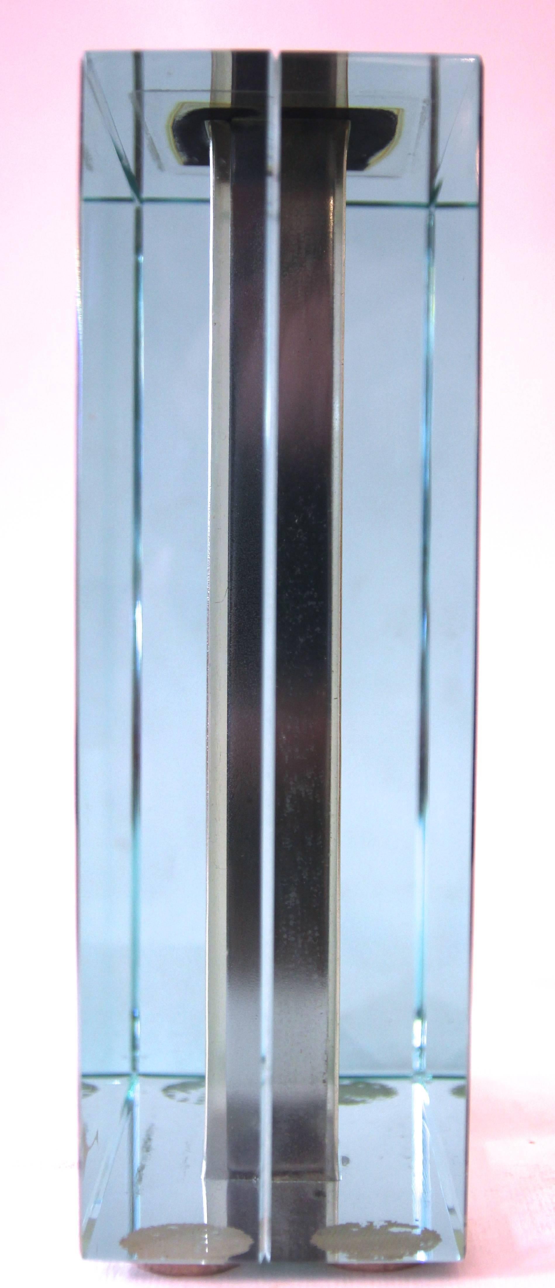 Fontana Arte,
Colorful crystal vase,
Metal chrome
Production Fontana Arte,
Adhesive label production,
Circa 1960, Italy.
Height: 20 cm, width: 14 cm, depth: 6 cm.