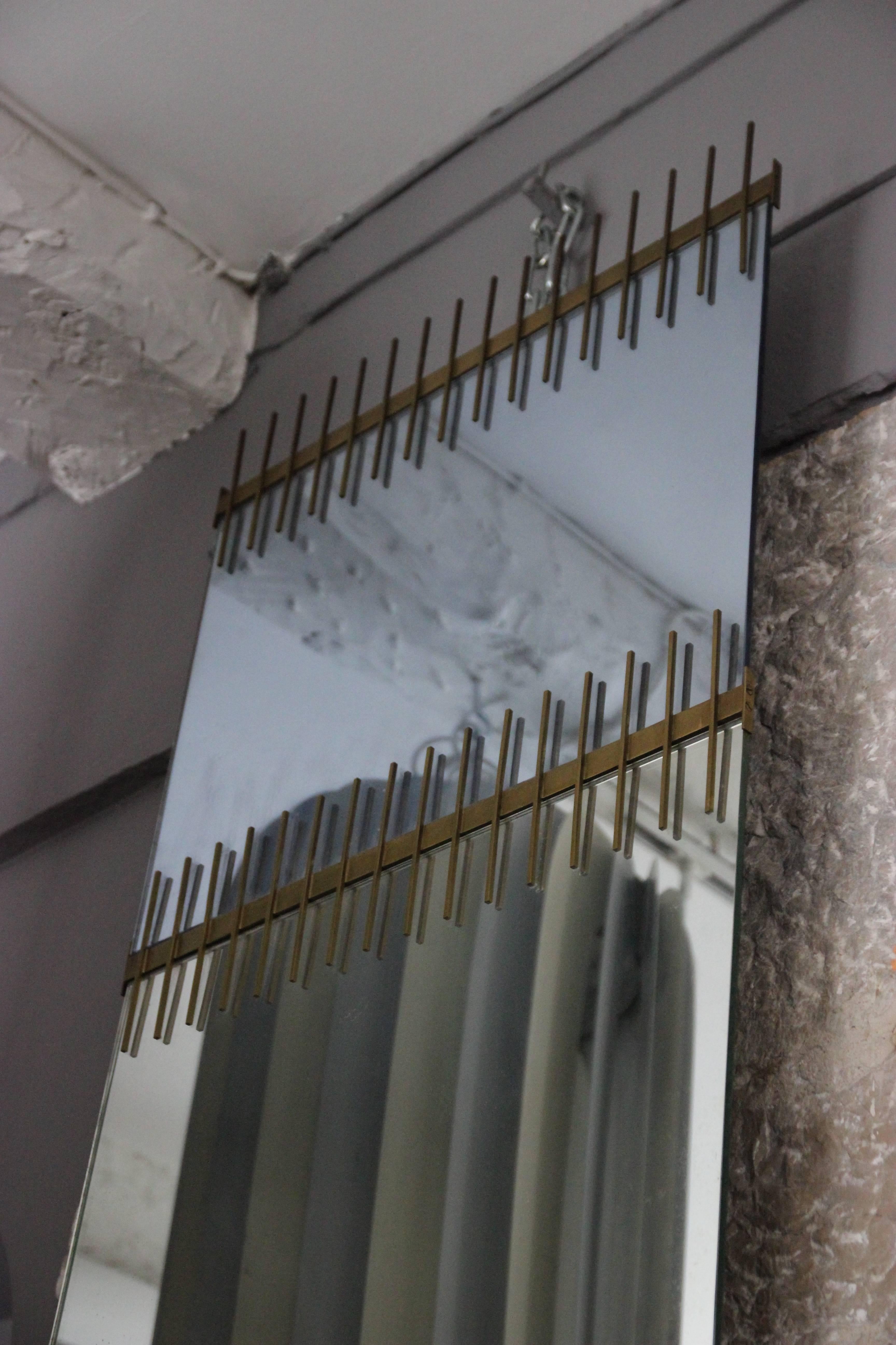 Ettore Sottsass, wall mirror manufactured by Santambrogio and De Berti, 
mirrored crystal, couloured mirrored crystal and brass,
2 labels ont he back: INDUSTRIE SPECCHI E CRISTALLI, Genova, 
N°1962 and N°1961,
circa 1958, Italy.
Height: 195 cm,