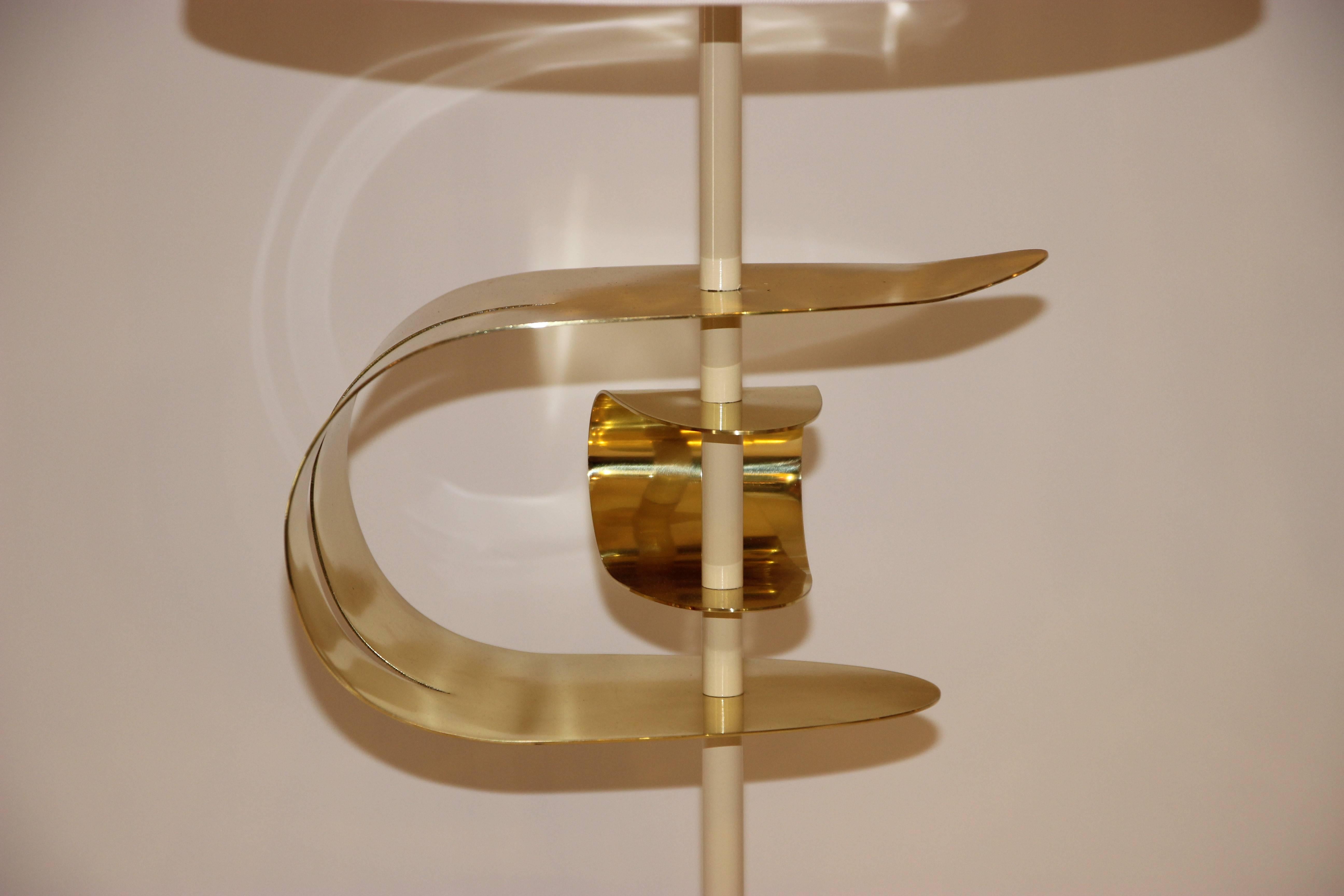 Angelo Brotto,
Pair of lamps, Esperie label,
Golden brass, lacquered metal and foot travertine,
Esperia edition, circa 2000, Italy.

Measures: Height 84 cm, width 12 cm, depth 13 cm.

Angelo Brotto (1914 - 2002) is an Italian artist and designer