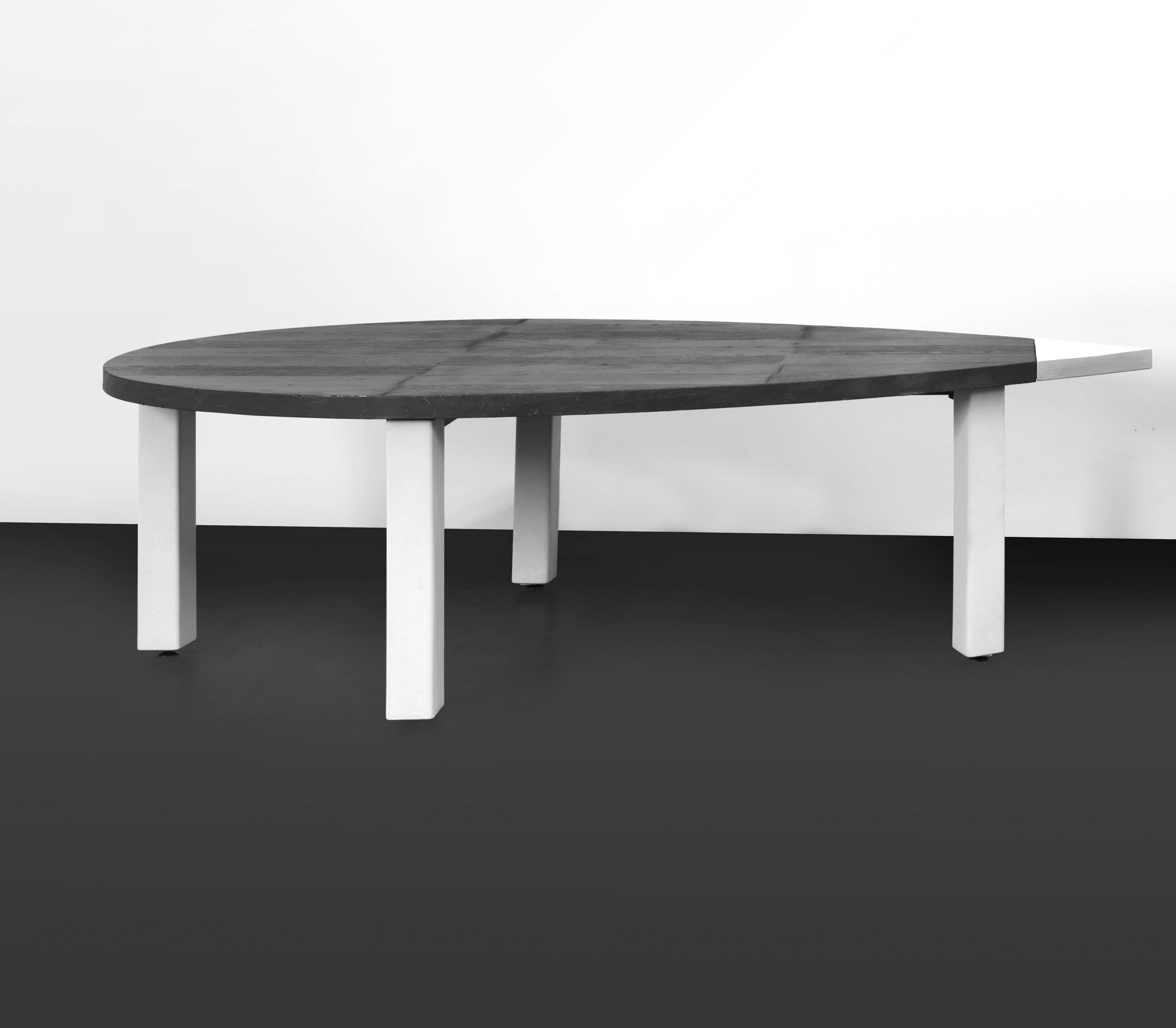 Pierpaolo Calzolari (1943), Laguna tables in two elements,
oak and beechwood, burnt cedar, lead and earthenware,
circa 1980, Italy.
Measurements each table:
Height 75 cm, width 2m50, depth 1m26,
total width (two tables): 5 m.

Biography: Ad Usum