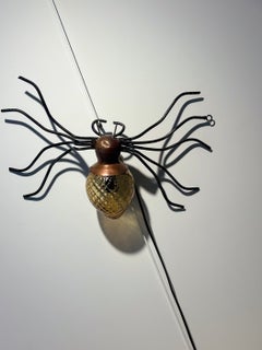 "Bee" wall light, brass, iron, and glass, circa 1960, France.