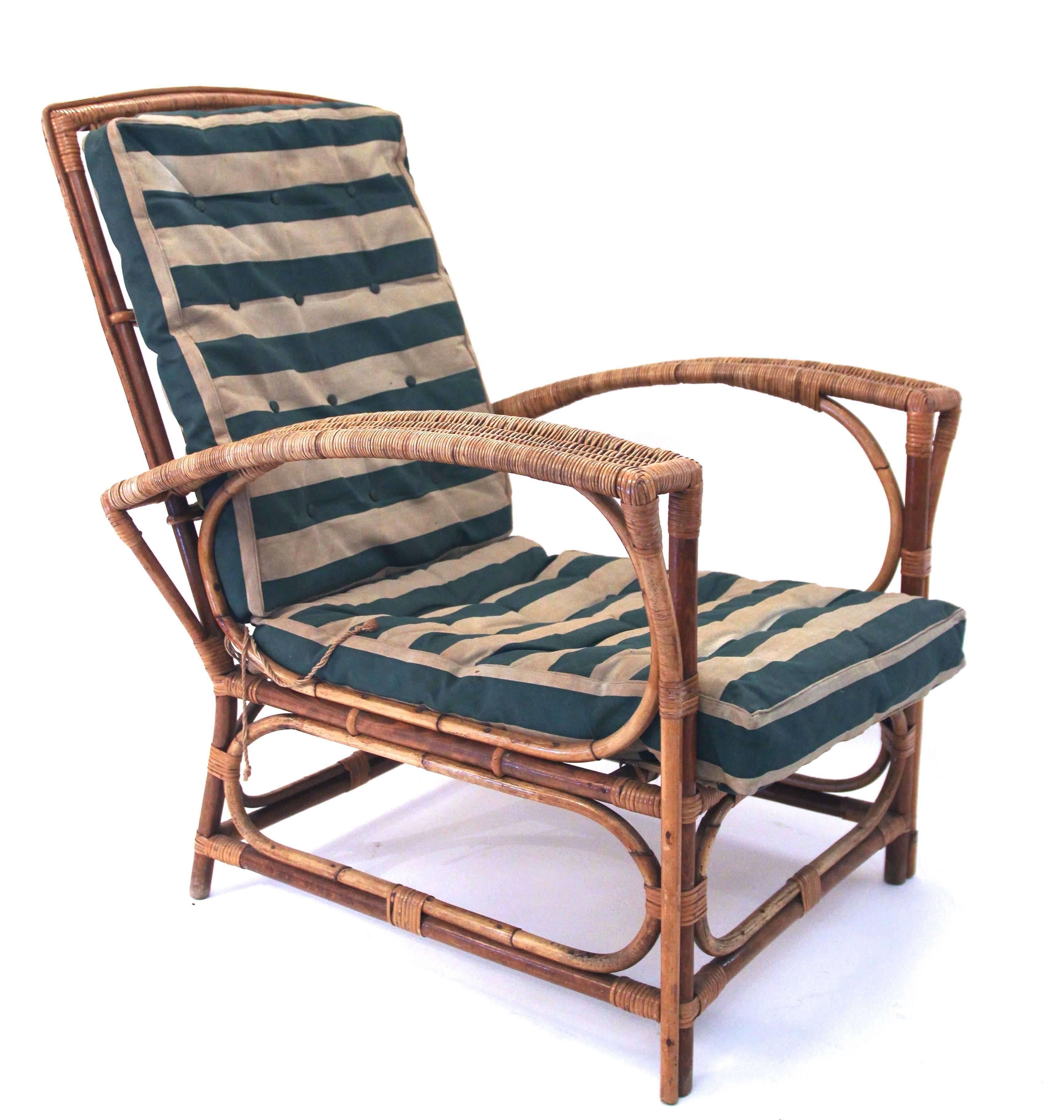 Set of four chairs and center table,
rattan,
circa 1960, France.
Measures: Armchair height: 96 cm seat height: 33 cm, width 74 cm, depth: 71 cm.
Table: height: 67 cm, diameter 62 cm.