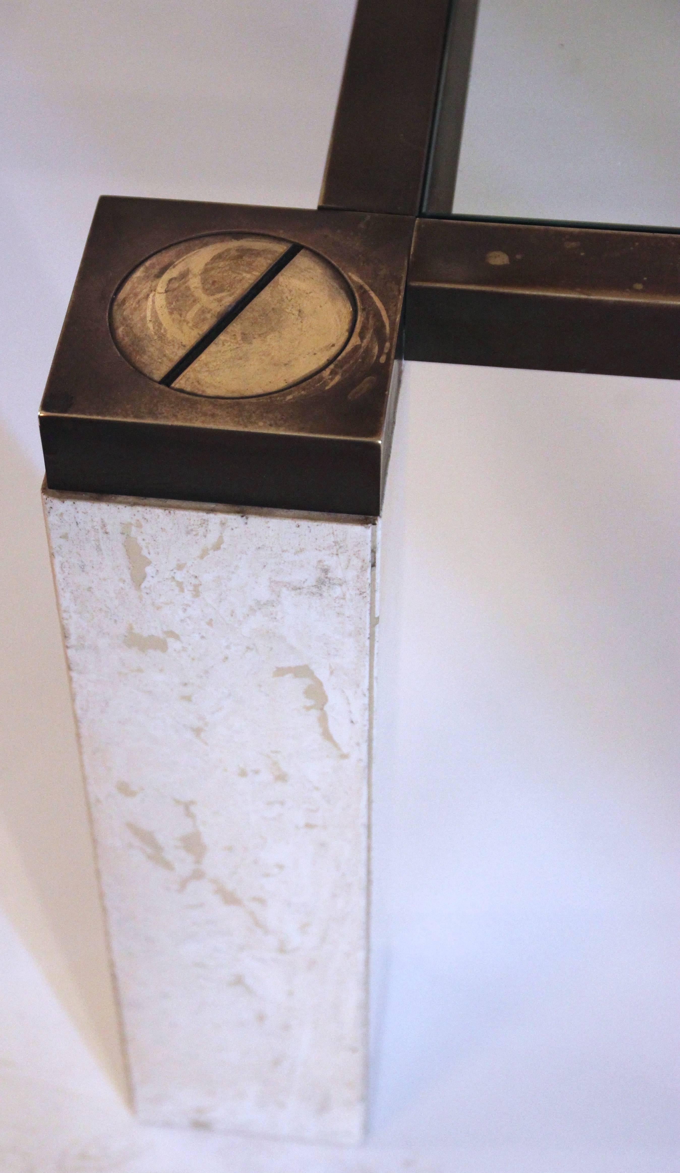 Coffee table by François Catroux,
glass top,
travertine base and polished brass structure,
bronze patinated 