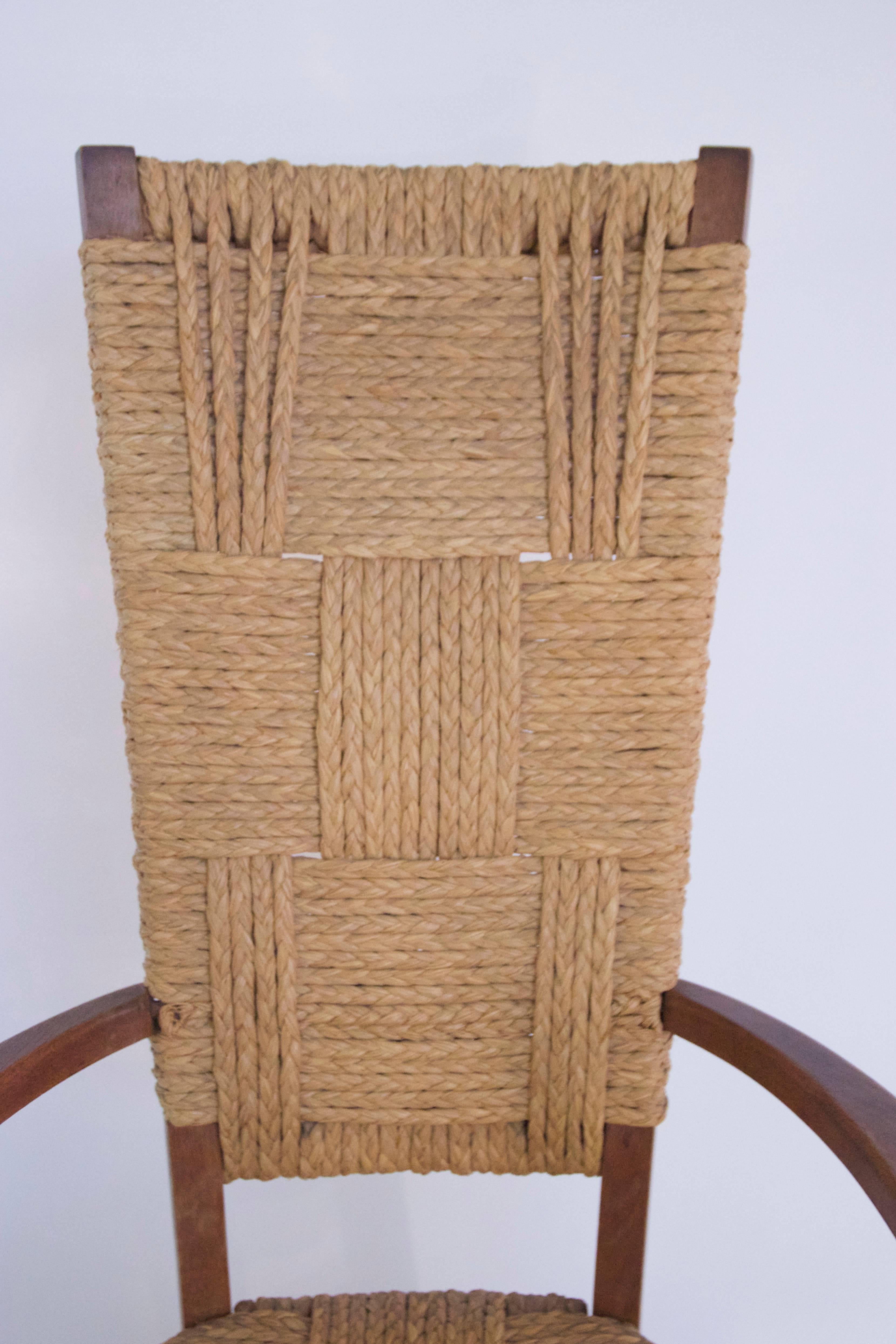 Audoux-Minet, suite of four armchairs,
Rattan and wood, 
circa 1970, France. 
Measures: Height 110 cm, seat height 45 cm, width 56 cm, depth 40 cm.