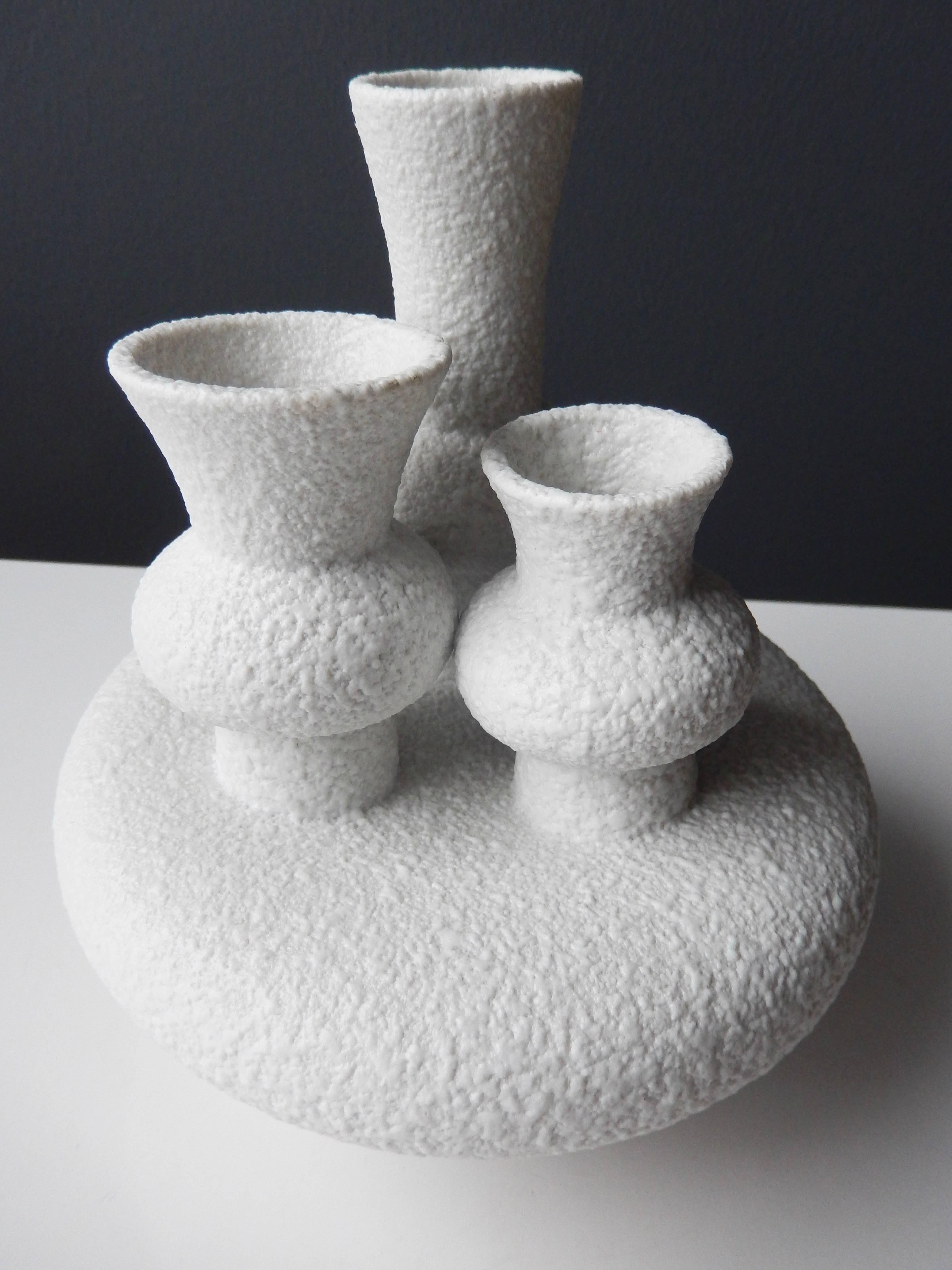 A sculptural Sgrafo Modern Korallenform vase with modernistic forms atop a circular, pod-like base. The unusual design recalls Gaudi's idiosyncratic forms. A bold, unique example of postwar German ceramics. Signed and numbered.