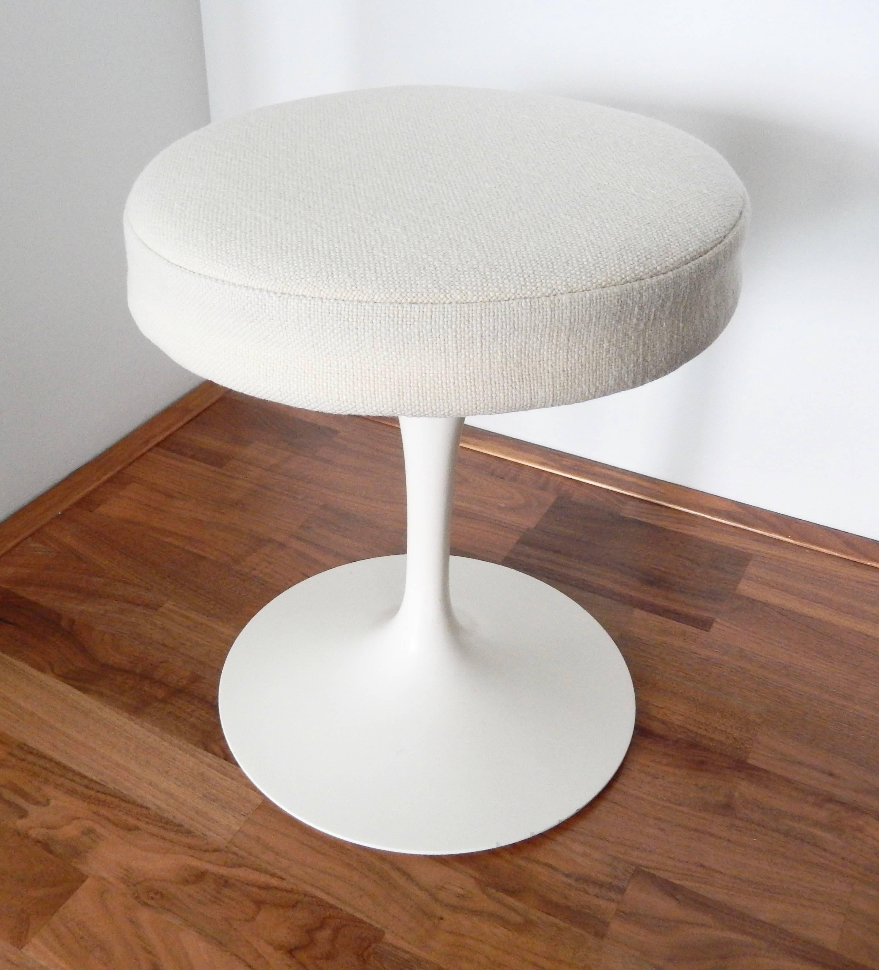 This iconic swivel stool, designed by Eero Saarinen, was first introduced by Knoll in 1958 as part of its Pedestal collection. It has become a modern design Classic. This rare example, with its original white wool Knoll fabric, is in very fine