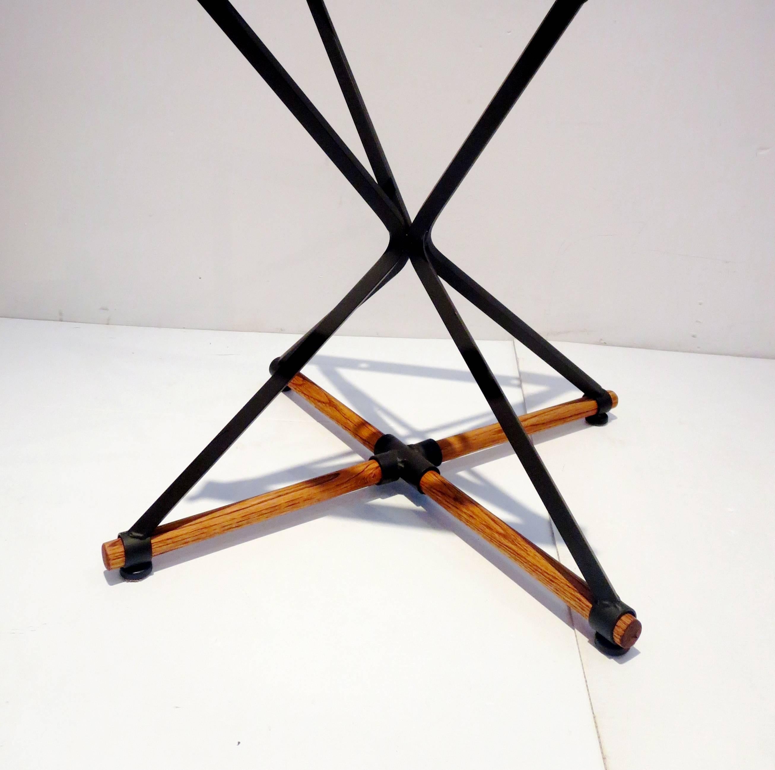 A rare table designed by Cleo Baldon, circa 1960s, solid iron with oak cross bar and Italian round marble sitting on top, the base has been resprayed on black mate, the oak bars refinished its solid and sturdy.
