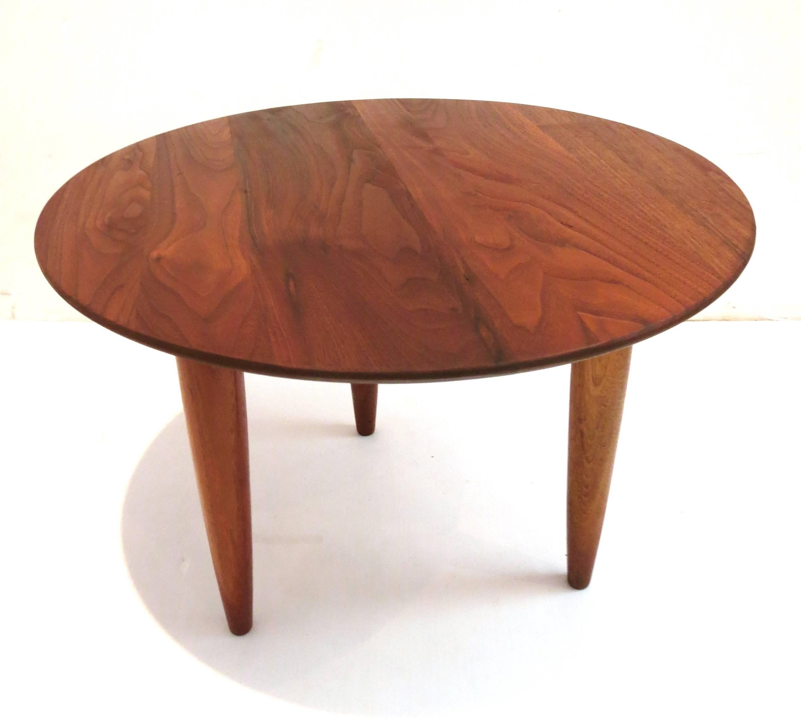 Beautiful simple elegant small round cocktail table with beveled edge manufactured by Ace -Hi .in solid walnut freshly refinished, part of the Prellude line.