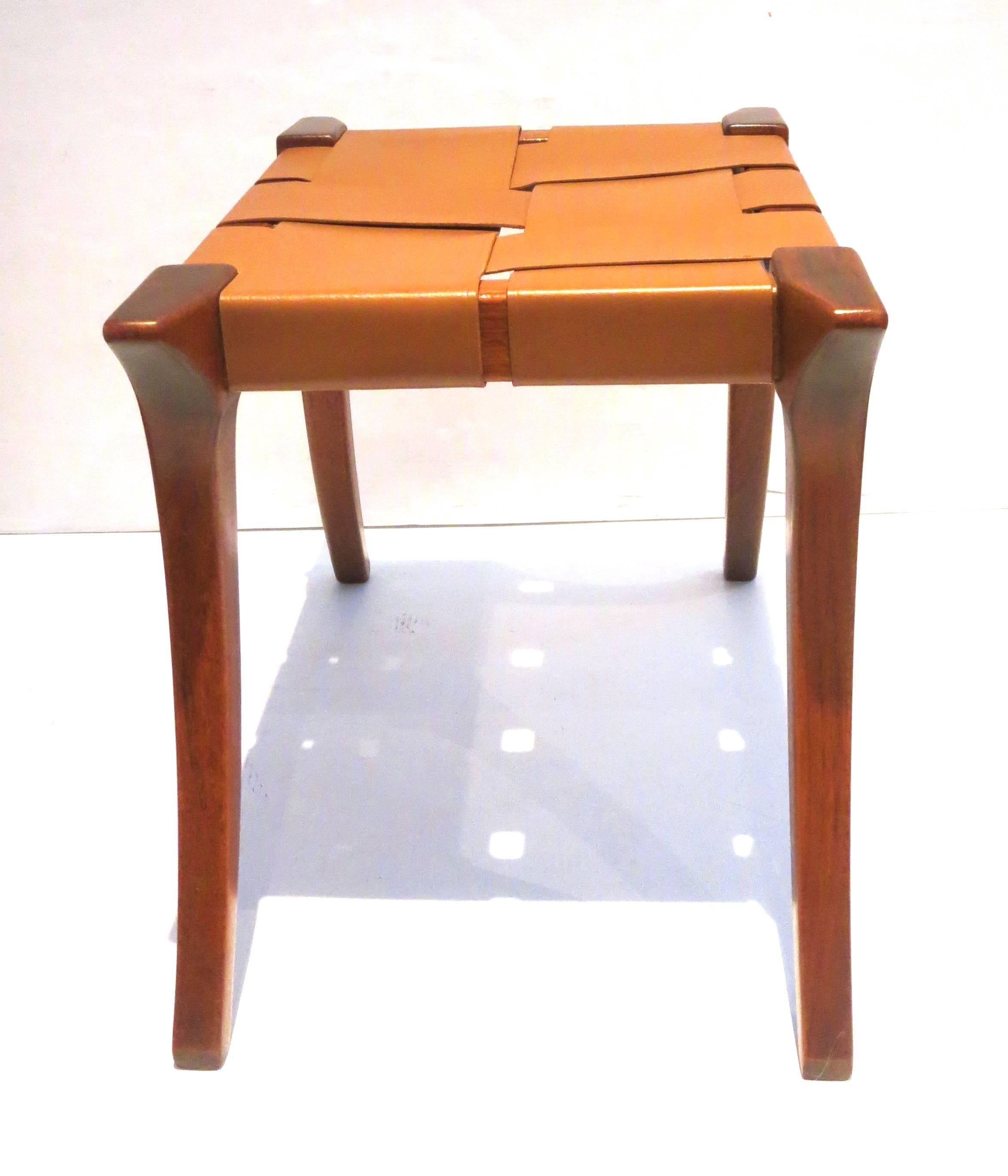 Rare set of two matching Klismos benches or stools, in the style of Robsjhon Gibbings, circa 1970s. Solid mahogany frame, with saddle leather straps, each bench its solid and sturdy great craftsmanship and nice original condition.