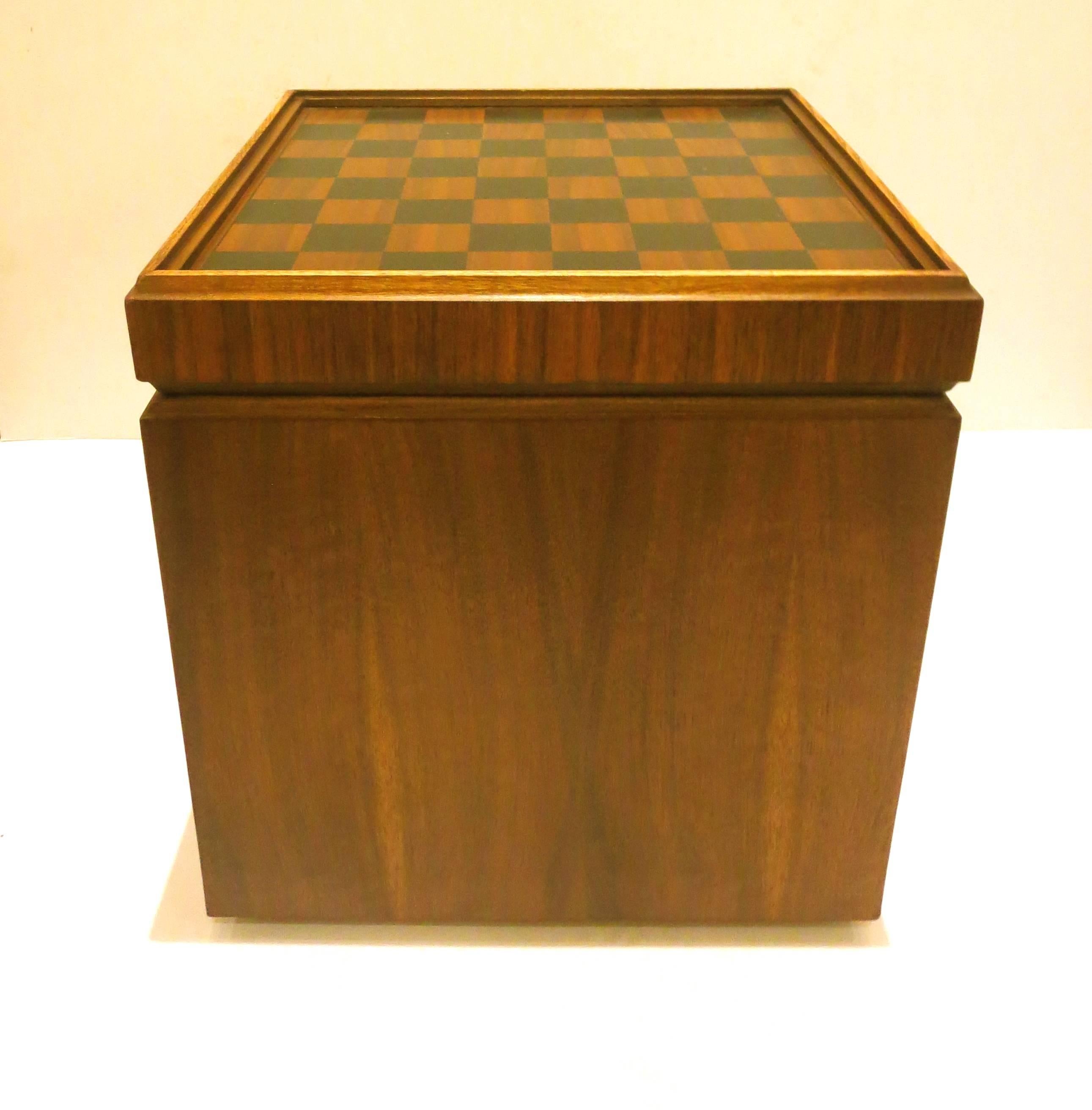 A very unusual cube chess table / stool, in walnut circa 1950s beautiful grain on the wood, top opens an flips to convert in a stool and has inside storage, freshly refinished, in black Naugahyde bottom and tiny casters feet.