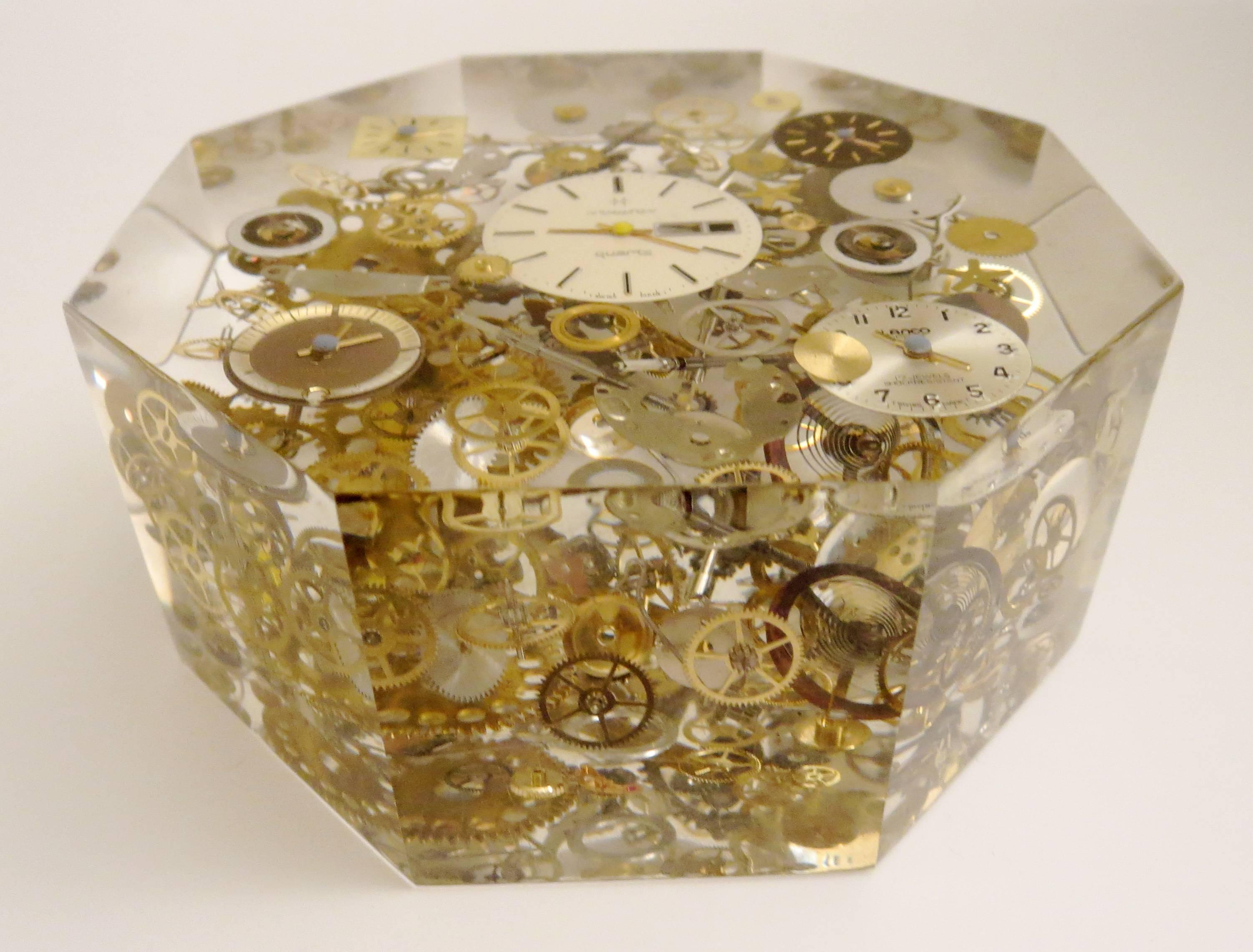 A very rare and difficult to make frozen clock parts and mechanism, in polished Lucite in an octagon shaped box 2