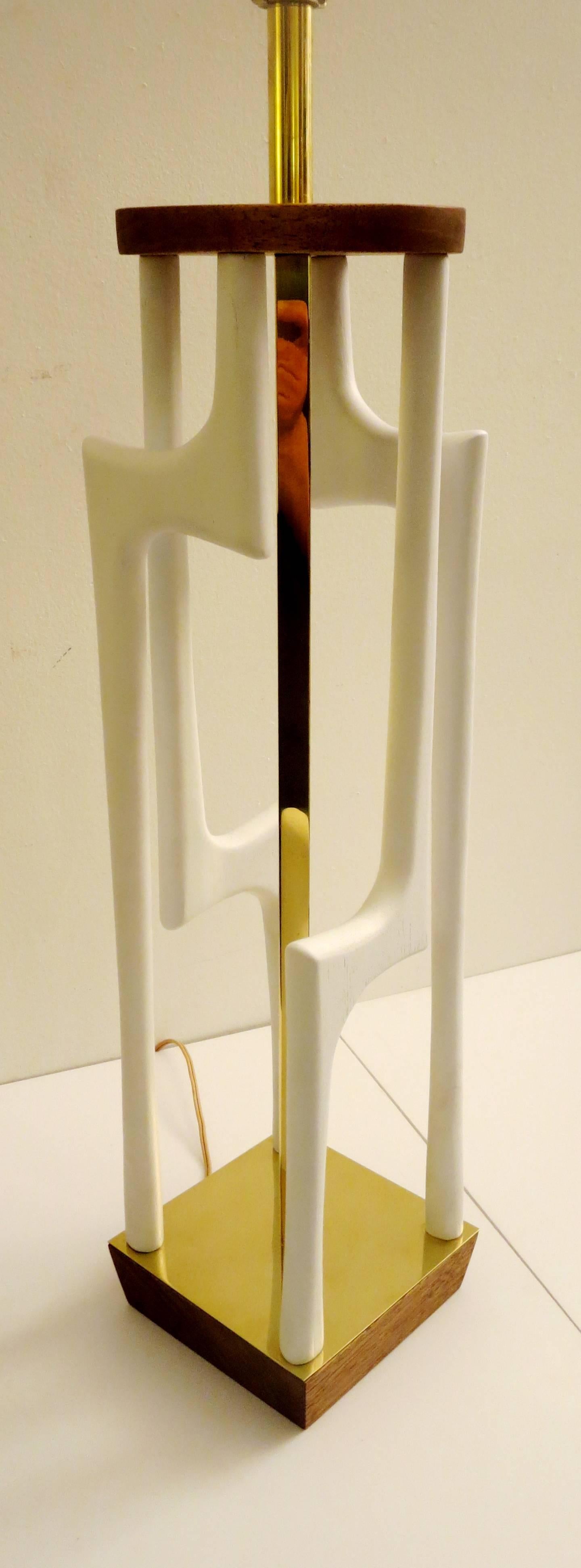 One of a kind tall sculpted white lacquer wood, with walnut and brass accents, circa 1950s American modern, freshly rewired and refinished with polish brass, lampshade its not included. Its 9