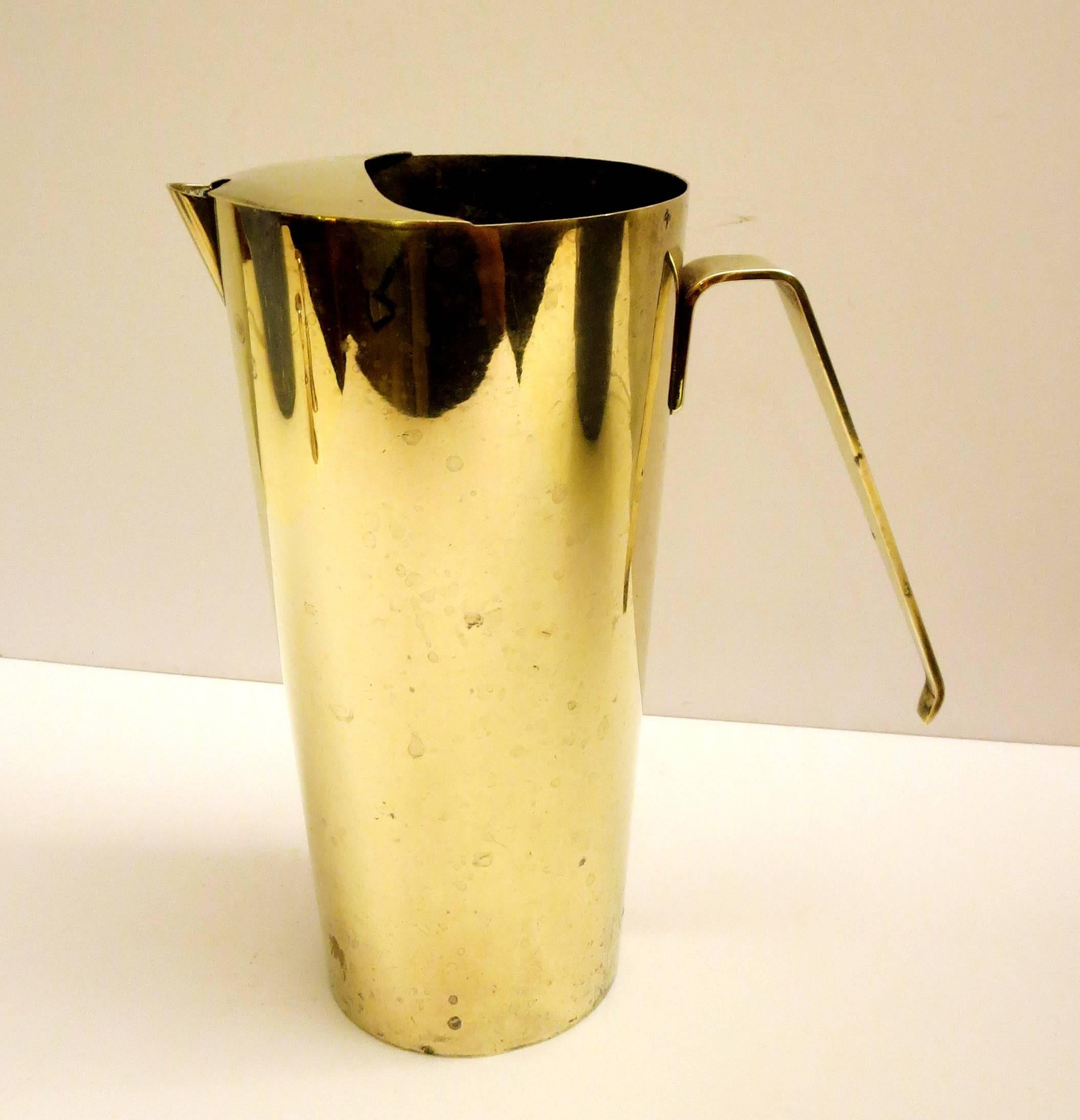 A very unique solid polished brass Italian water pitcher, circa 1950s great design I polished the outside but left a bit of wear, its simple elegant nice handle, very nice condition with no dings.