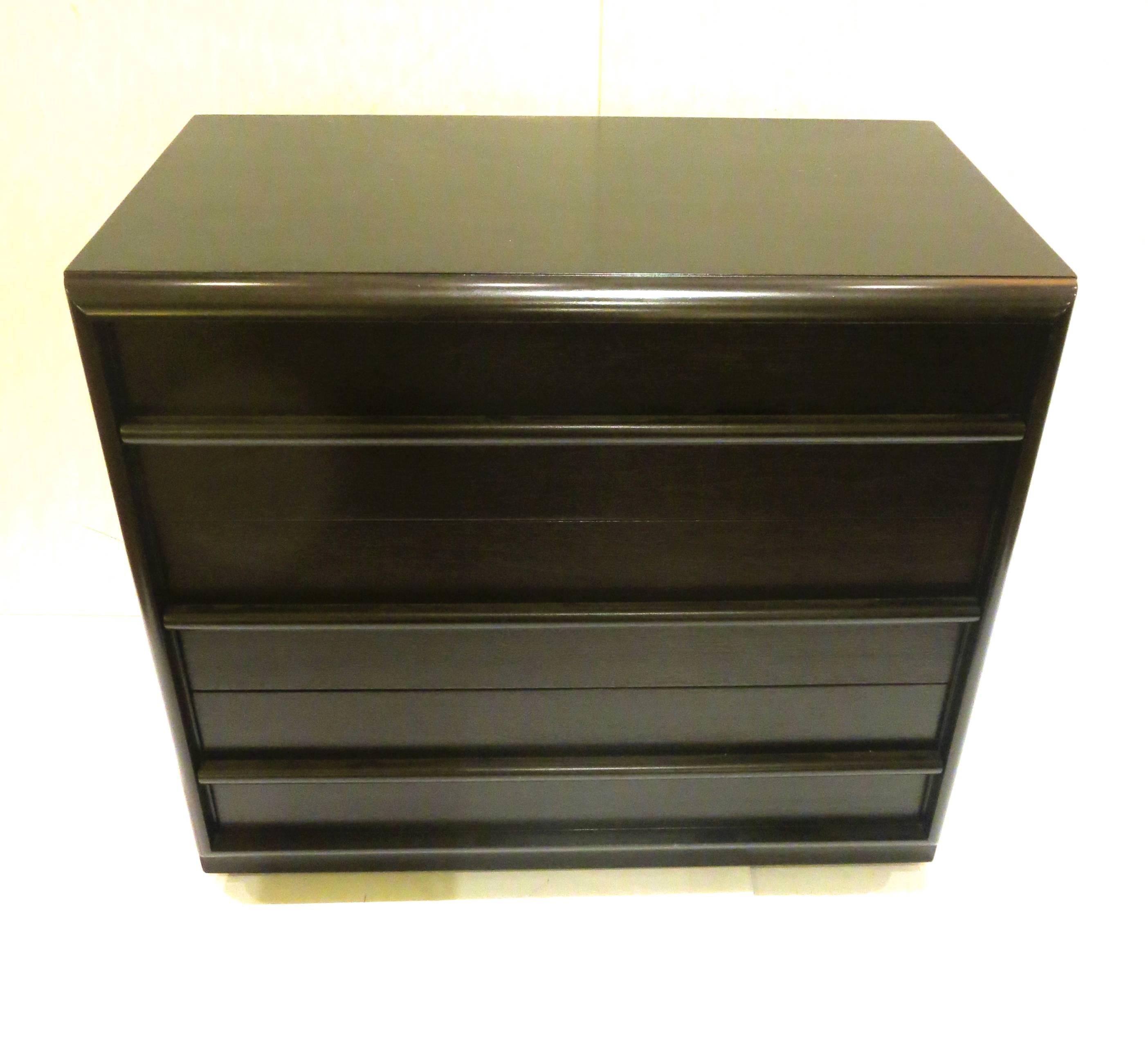 Elegant small triple-drawer dresser designed by Robsjohn-Gibbings for Widdicomb, circa 1950s. Nicely refinished in black ebonized lacquer, perfect size for a guest room.