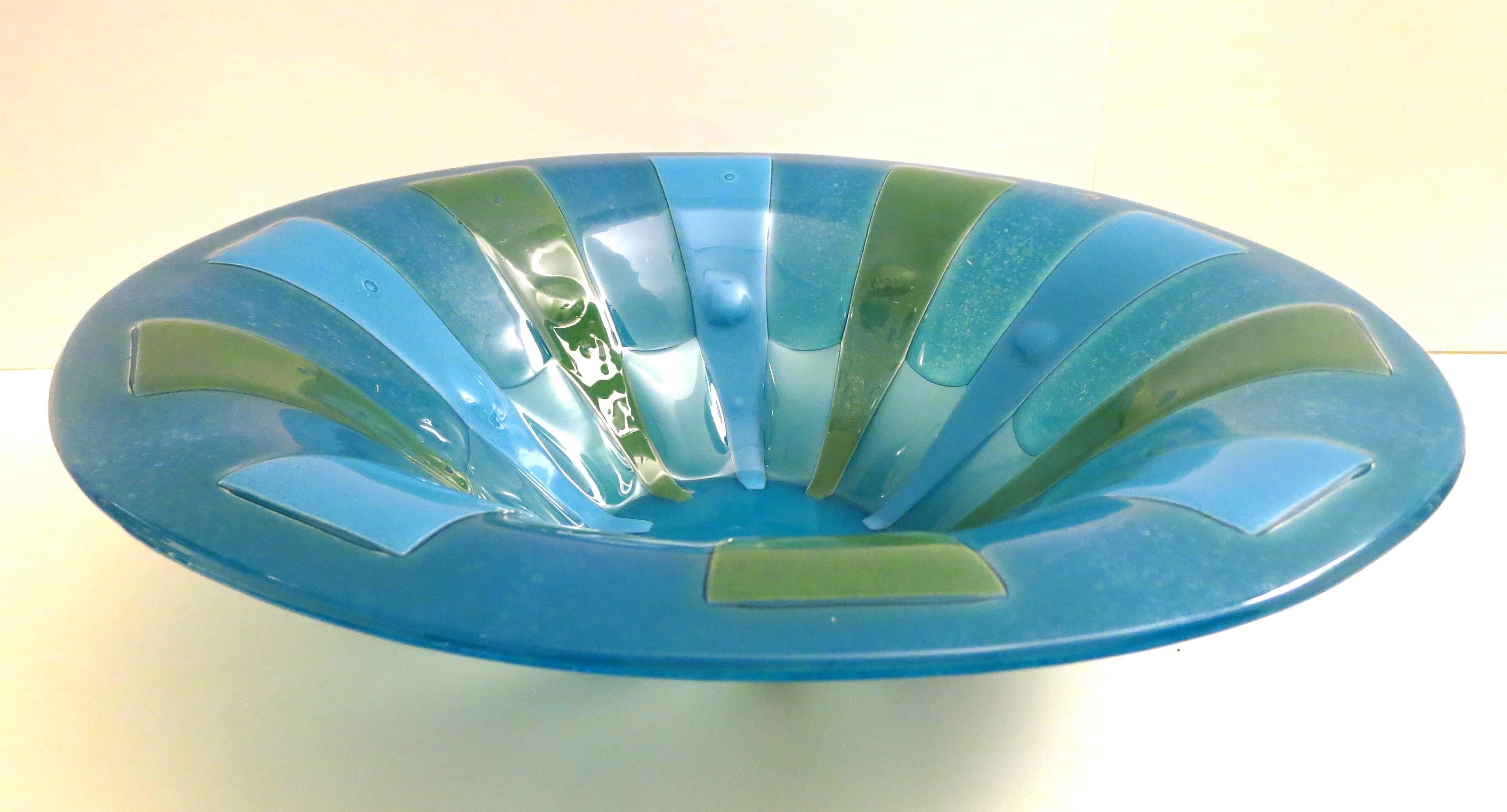 Beautiful colors on this large impressive glass bowl by Higgins Glass, circa 1960s great condition no chips or cracks, gold label on the side as shown, green a two tones of blue.