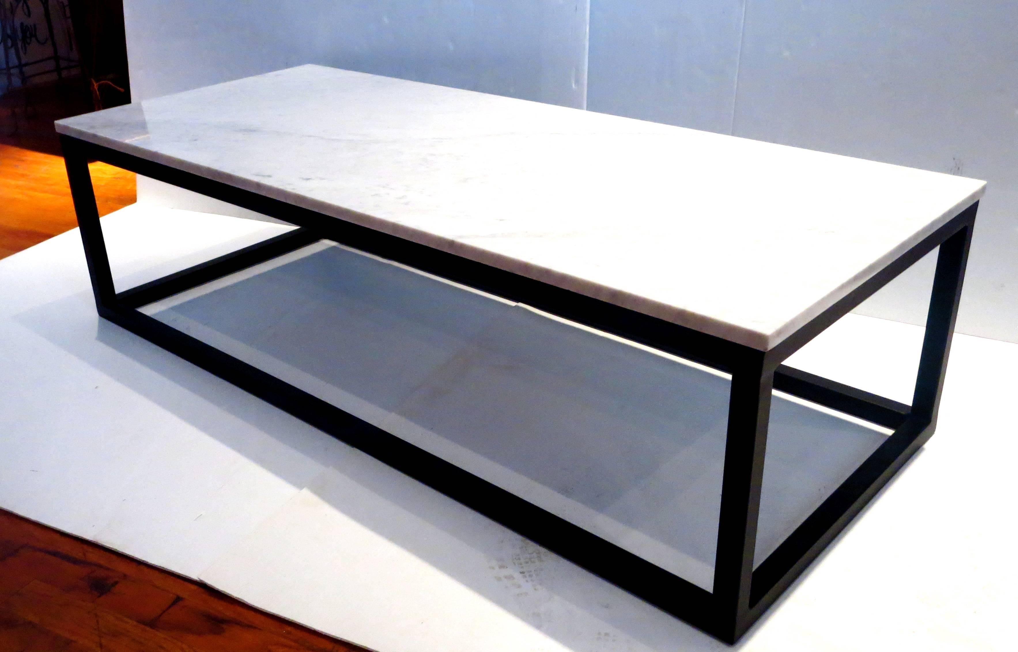 1970s rectangle coffee table, solid Italian white marble top sitting on square metal tube base, the base has been sand blasted and powder coated in flat black the top its polished with no chips or cracks and sits on top of the base, solid and sturdy.