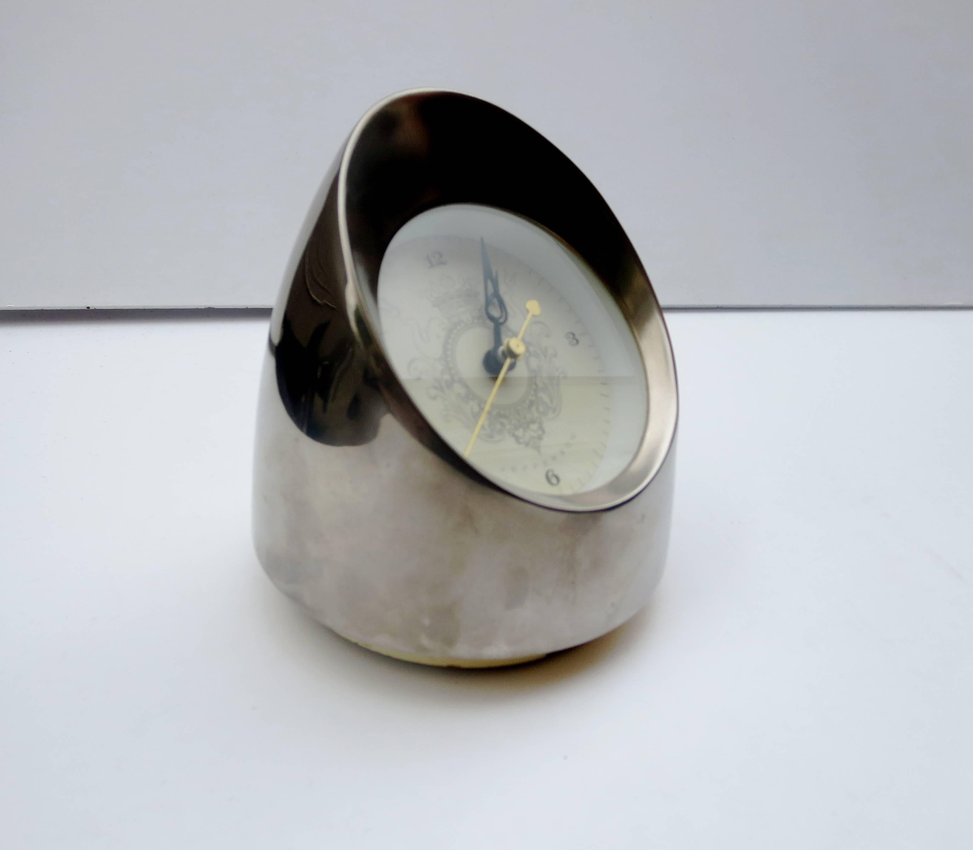 Elegant and unique desk clock, circa 1950s by the Jefferson clock company in great working condition. This model is rare and unique in a chrome finish.