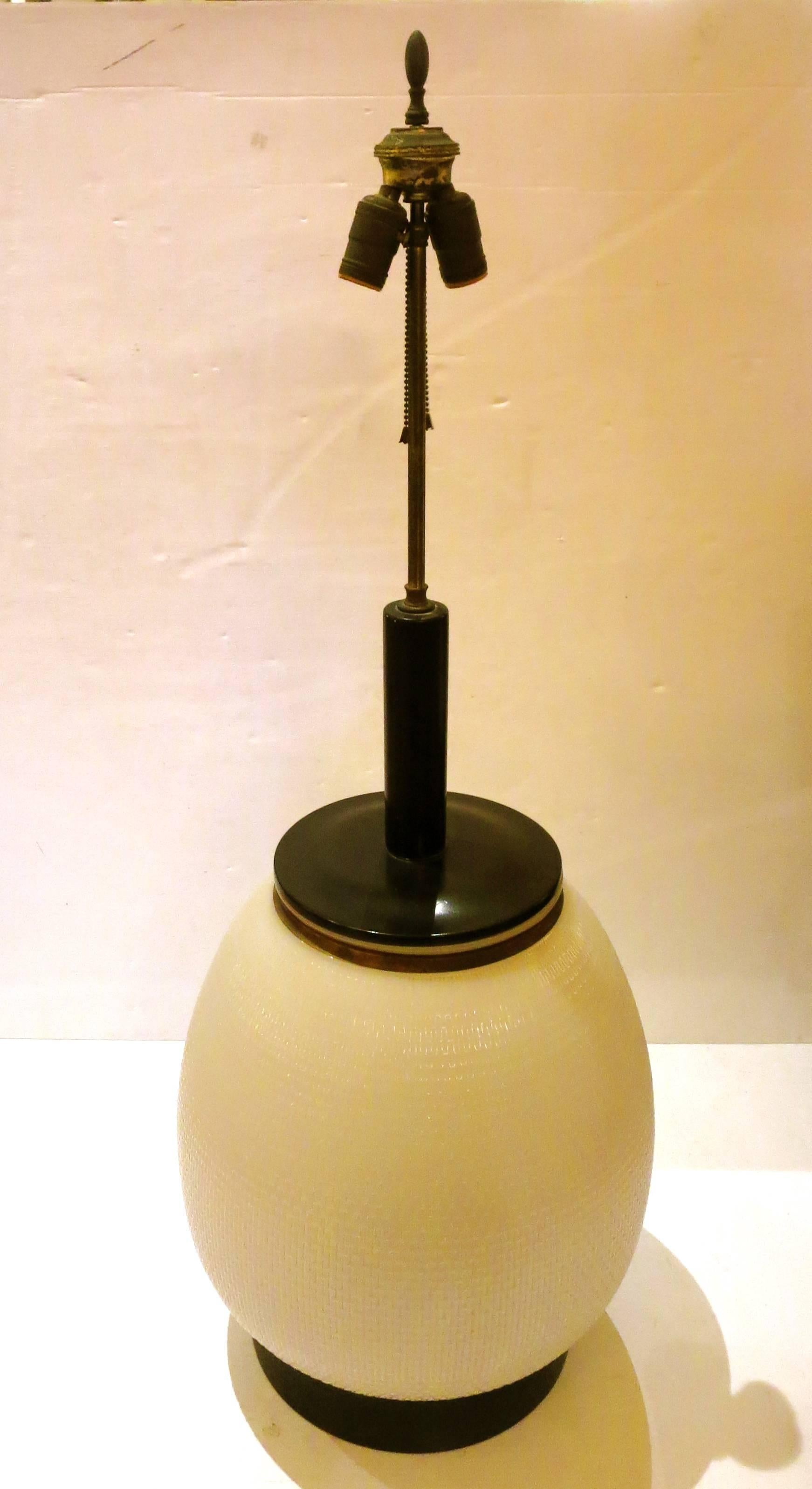 One-of-a-kind massive table base lamp by Westinghouse, milk glass converted into street lamp, circa 1940s, large and beautiful rewired double head socket and lamp base illuminates also, very nice and clean condition the sockets move up and down,