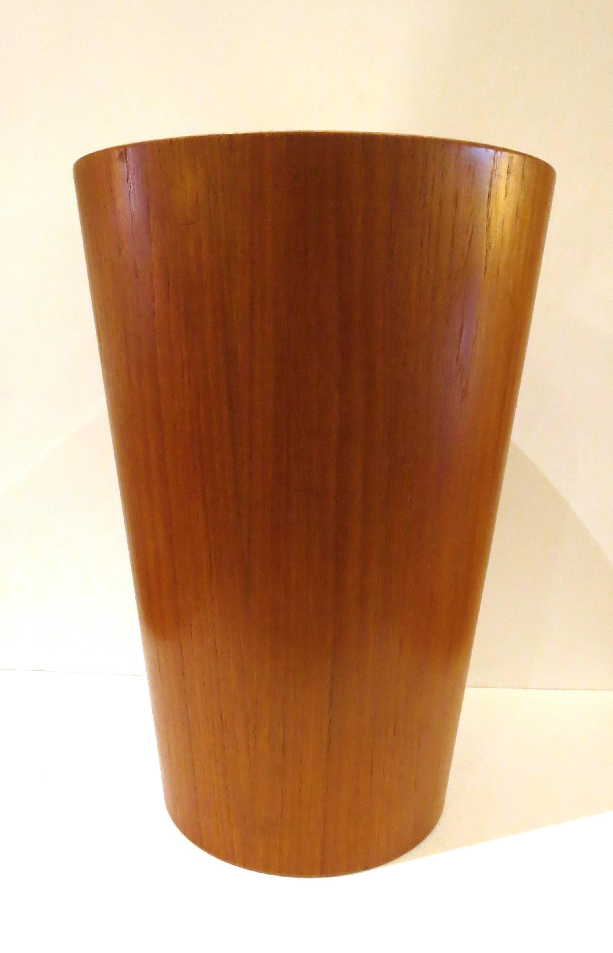 Simple elegant design on this trashcan, waste paper basket, circa 1950s, made in Sweden by Servex excellent condition no chips or cracks, in teak finish all original and in cone shape.
