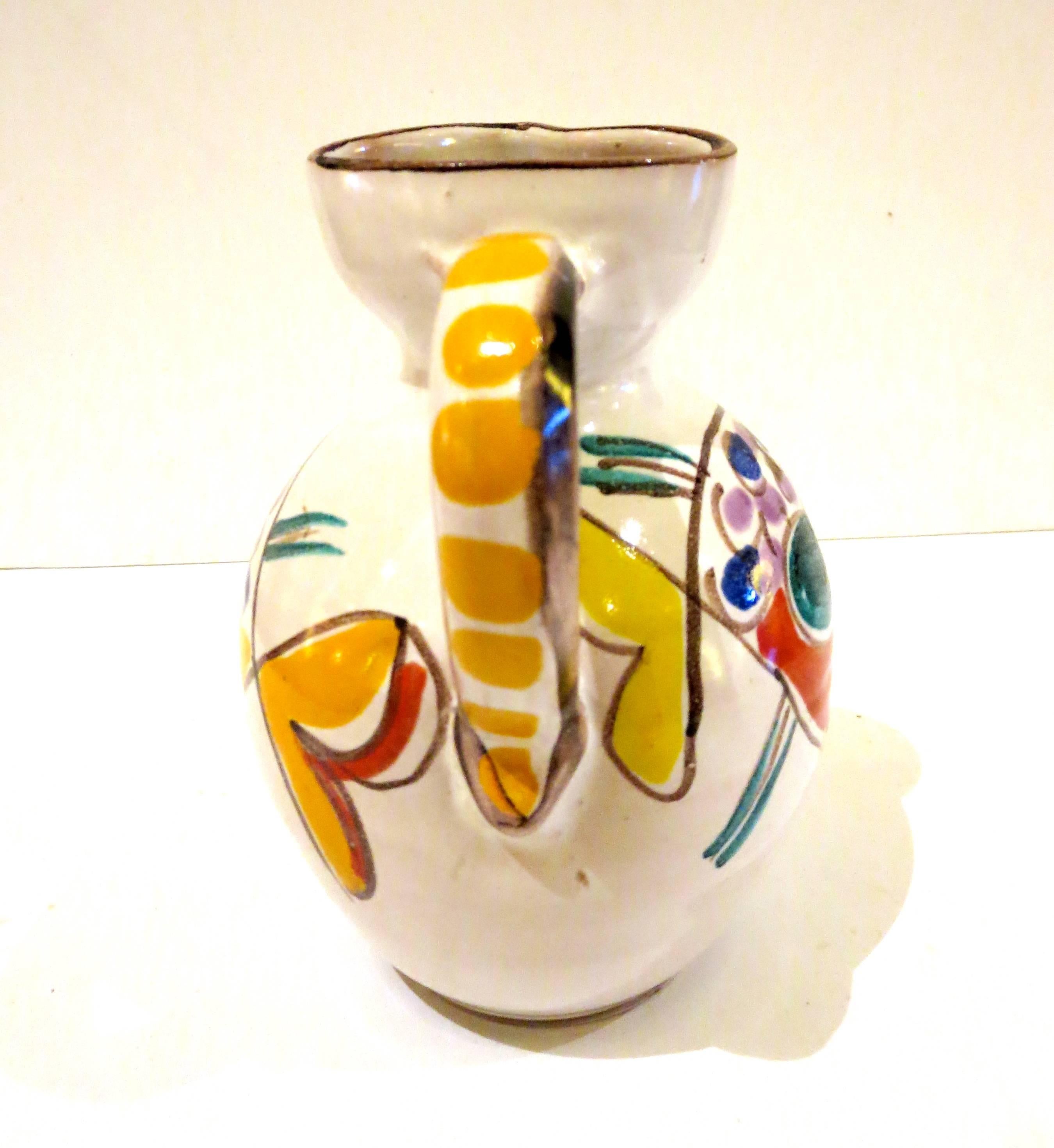Nice pair of ceramic items by famous artist DeSimone, hand-painted, circa 1950s, made in Italy. Nice colors and great condition no chips or cracks. Measures: The small vase its 5