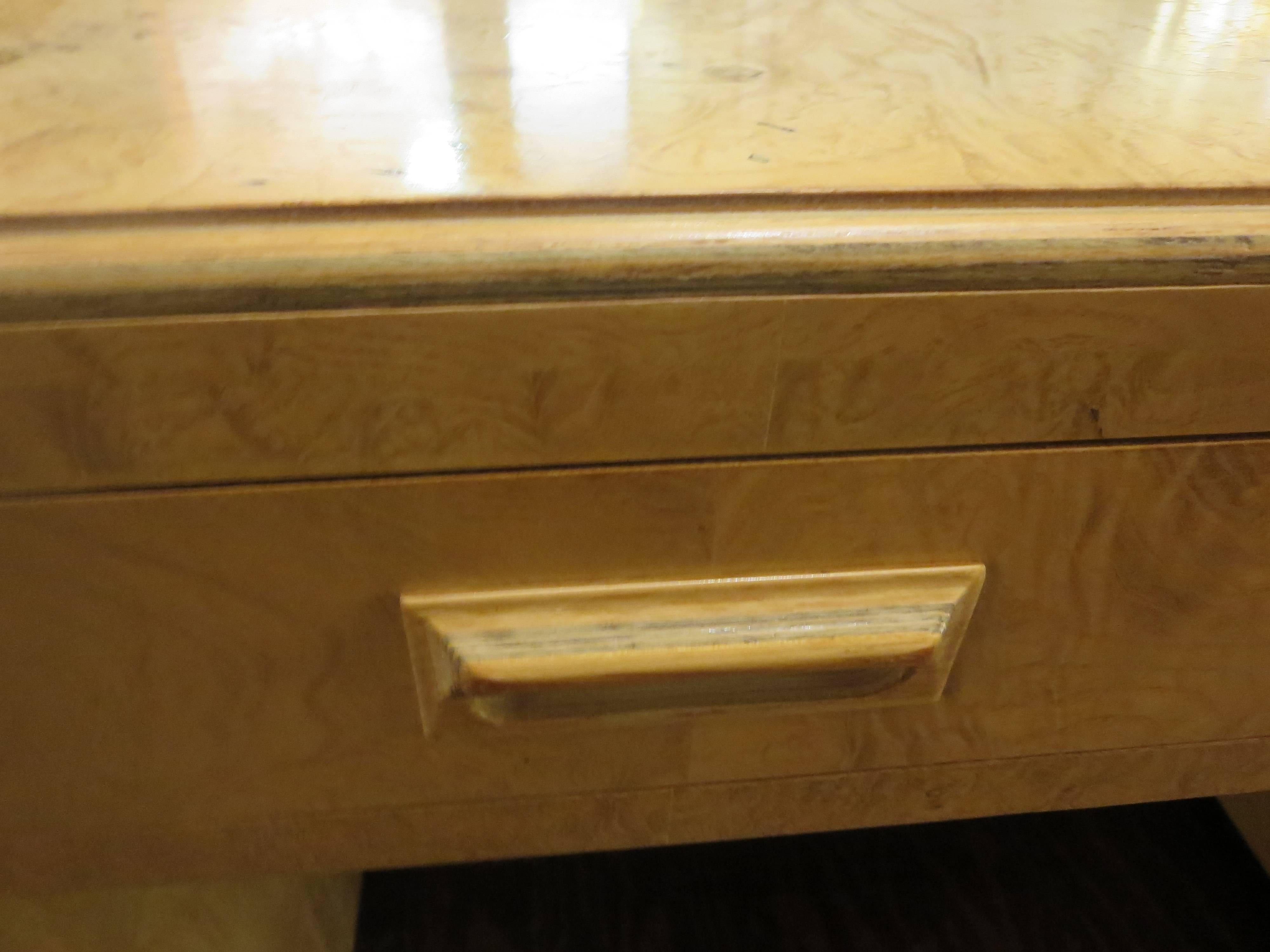 Incredible massive desk, circa 1970s designed and manufactured by Henredon, in beautiful olive burl wood with madagascar ebony accents and sides and front extensions, the desk comes in its original finish some light wear due to age, on the top shows