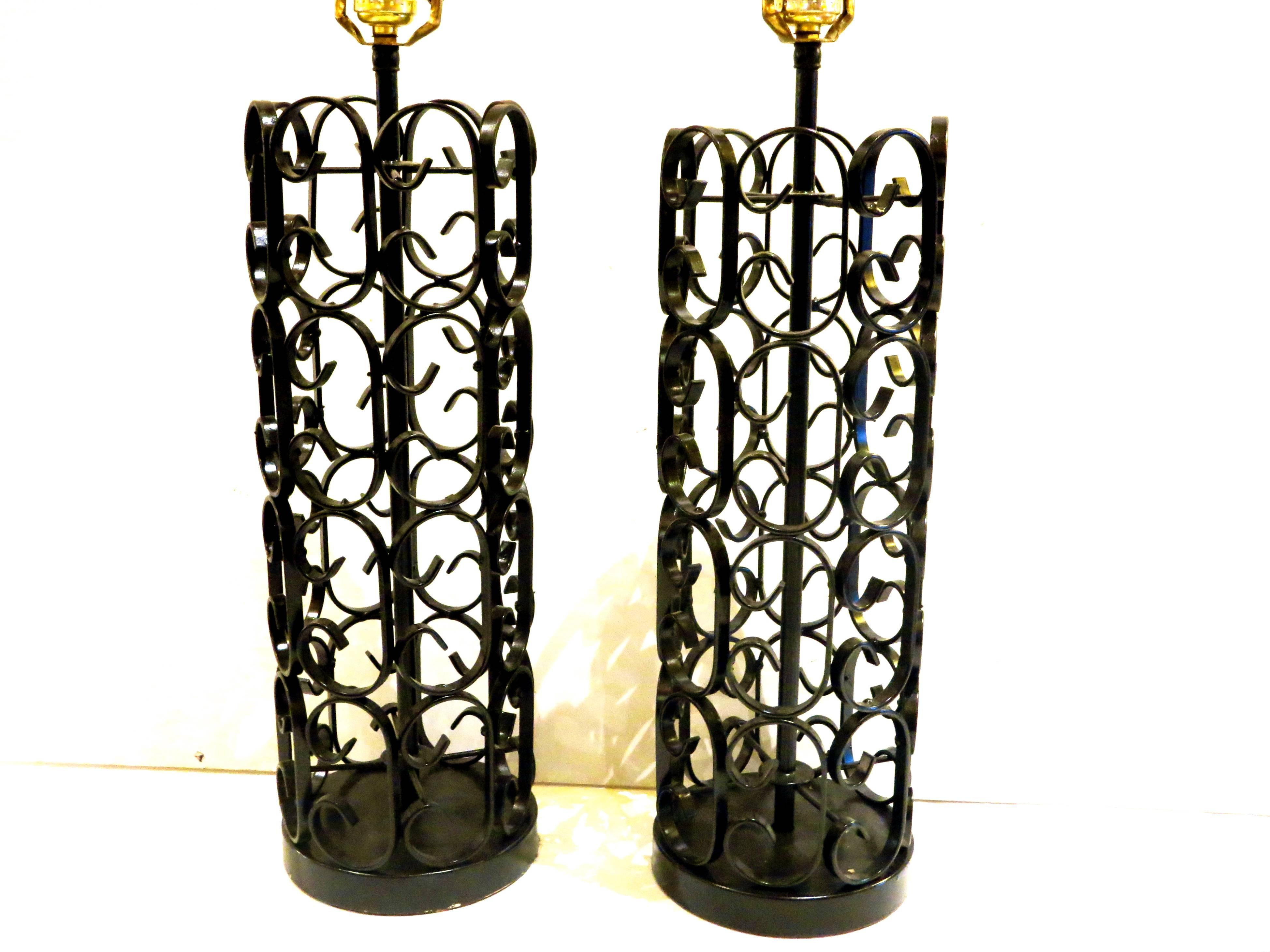 Nice set of two iron decorative table lamps, circa 1960s part of the Grenada collection designed by Arthur Umanoff for Boyuer Scott, the lamps have been reprayed in satin black, and rewired, NO Lampshades Included , these set its beautiful and