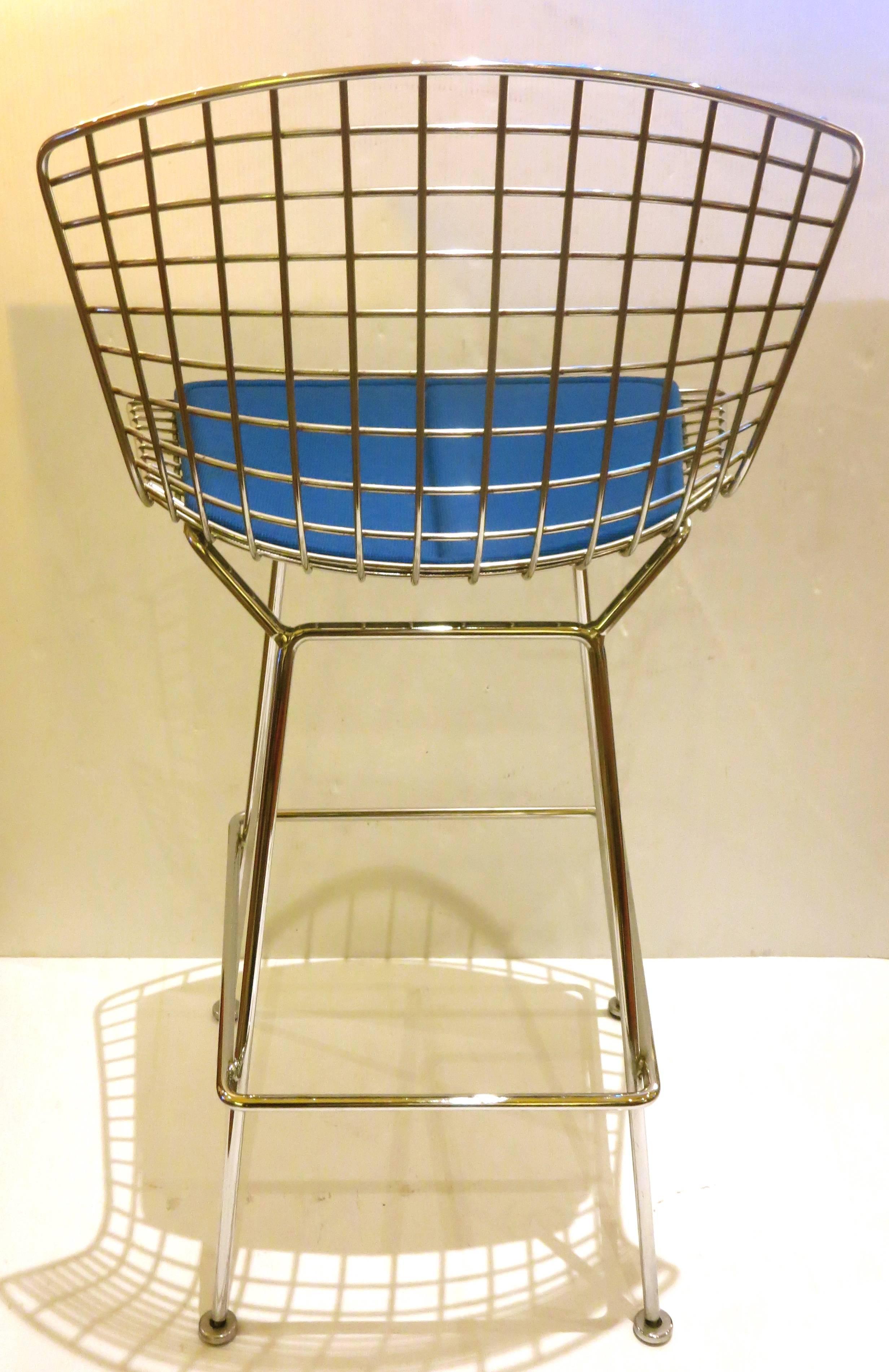 Nice pair of polished chrome barstools designed by Harry Bertoia for Knoll circa 1970s, good condition freshly polished the blue cloth seat pad shows light wear and light stains, but has nice foam and its clean overall.