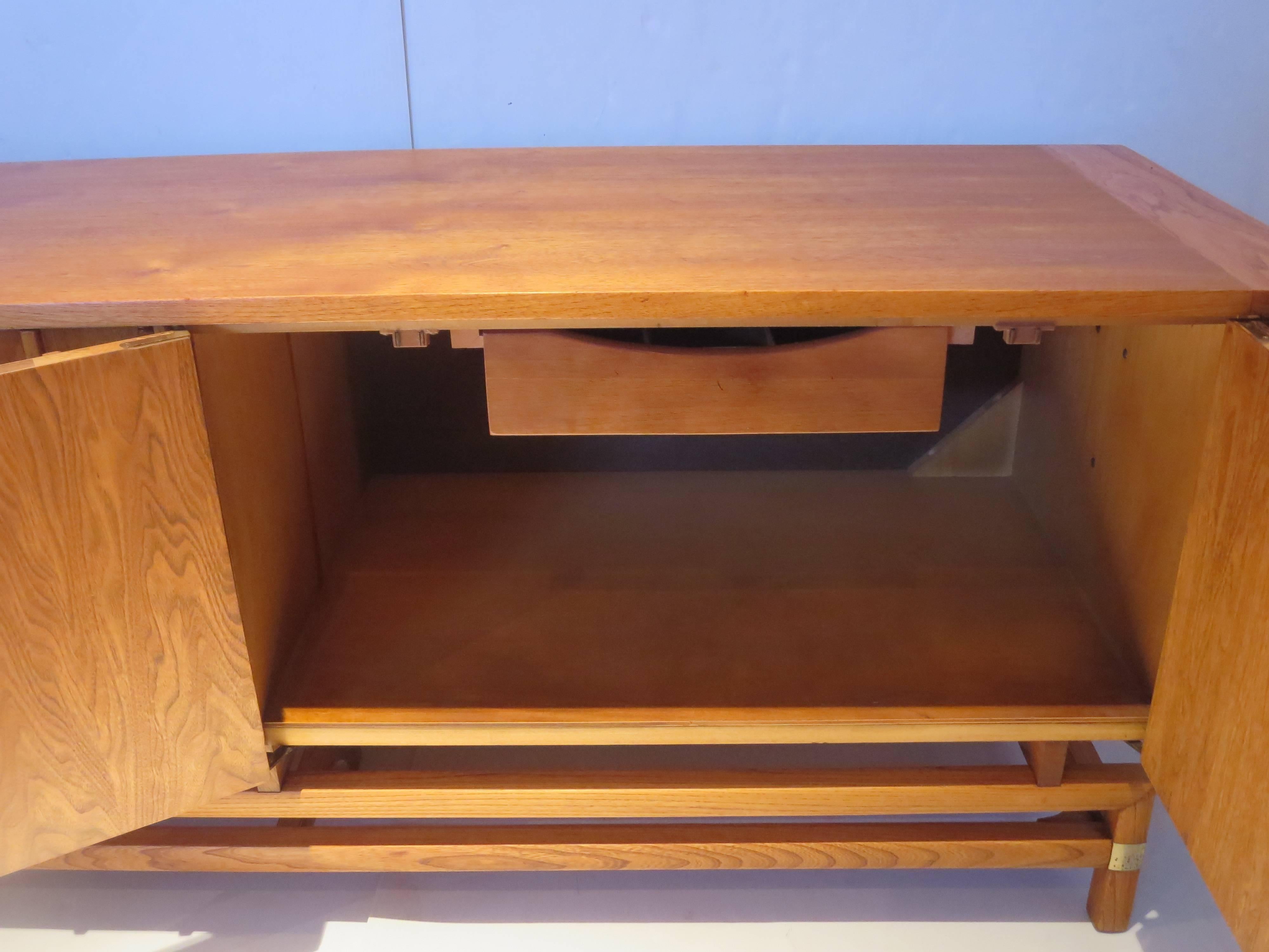 20th Century Striking 1950s, American, Mid-Century Large and Low Credenza With Brass Accents