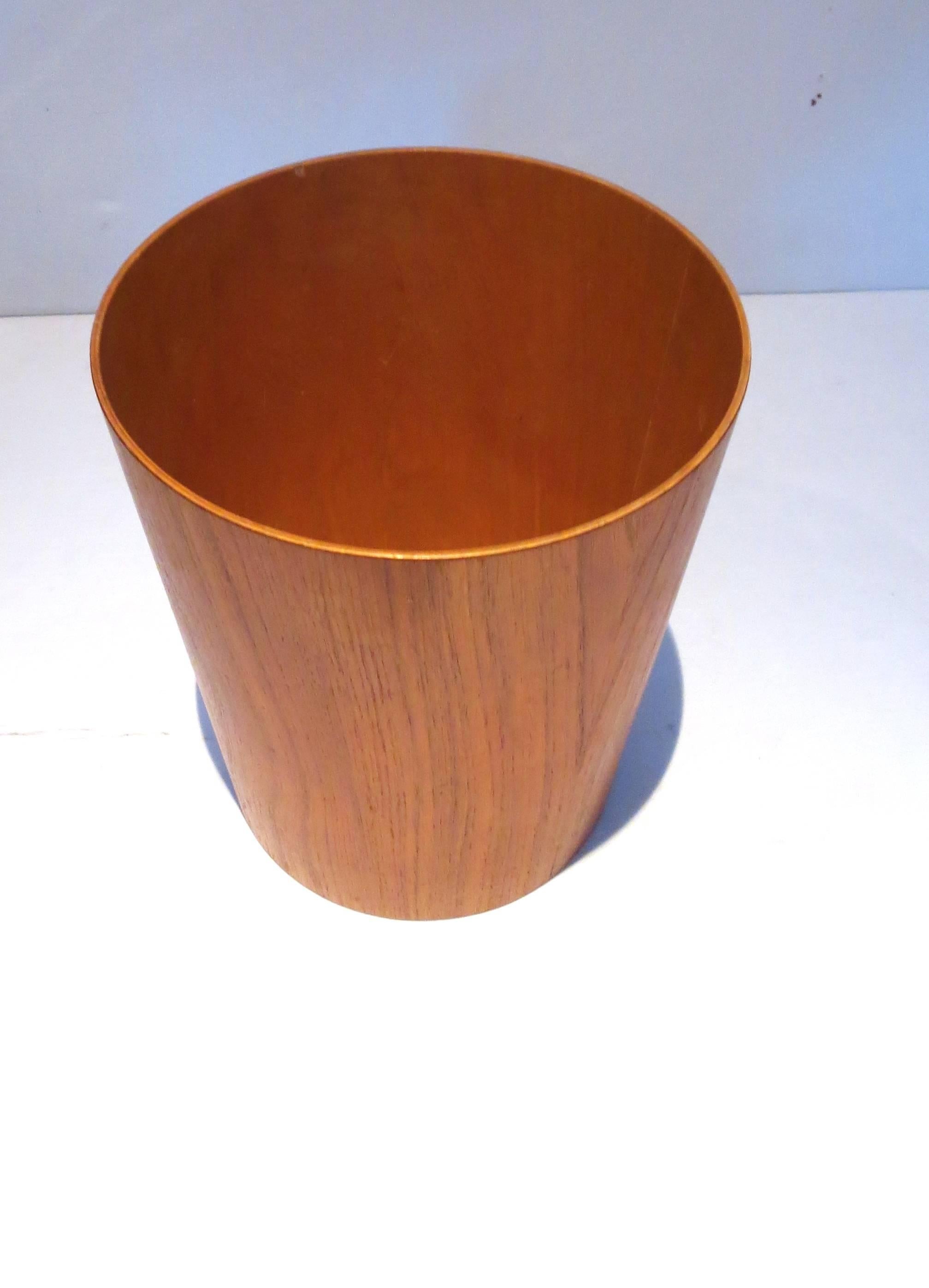 Simple elegant design on this trashcan, waste paper basket, circa 1950s, made in Sweden by Servex excellent condition no chips or cracks, in teak finish all original and in cone shape.