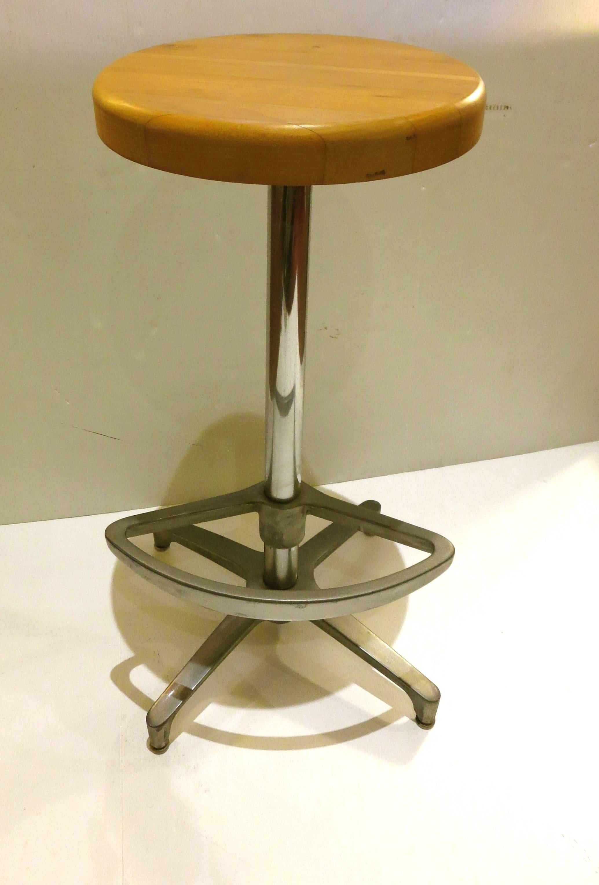 Great set of three Atomic age, barstools with swivel tops and adjustable footrest, aluminum star base with aluminum footrest, polished chrome pole and solid thick light walnut top.