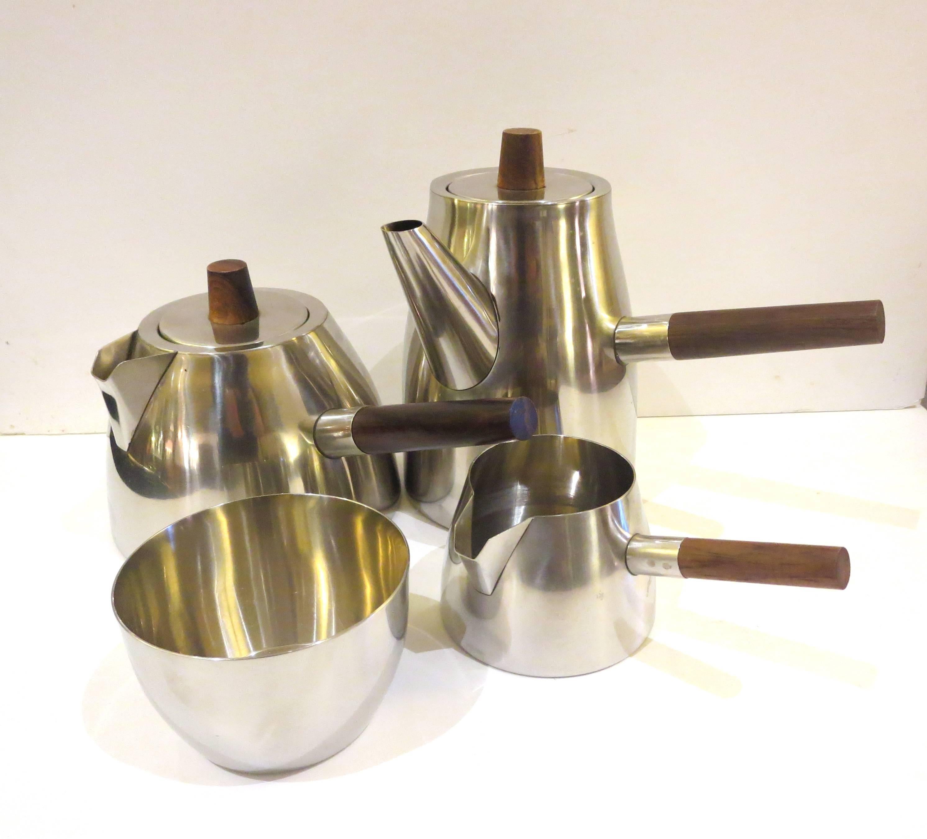 Great four-piece set designed by Tias Eckhoff for Lundtofte, stainless steel and rosewood, polished finish, very nice condition a rare set hard to find.