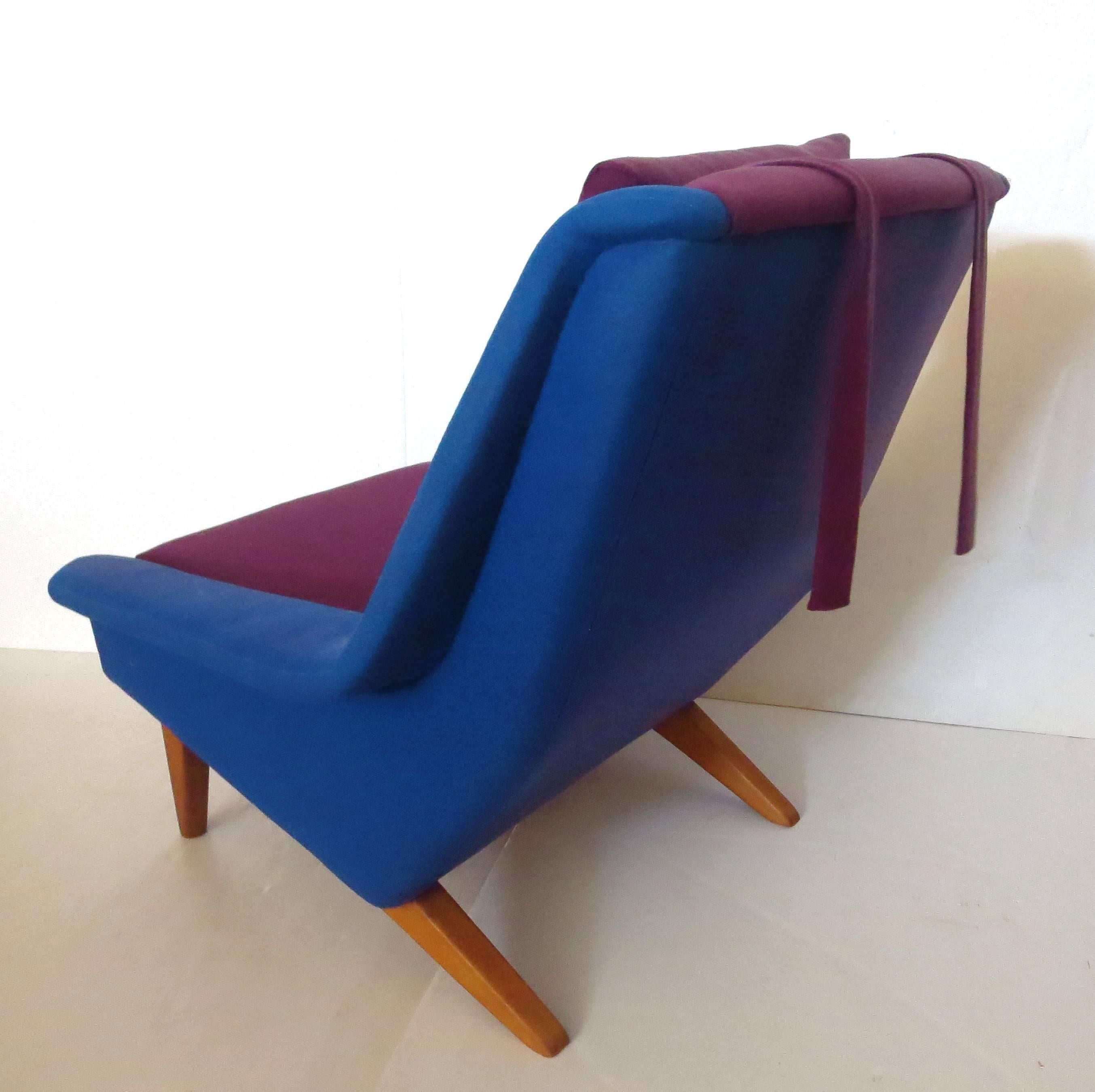 Striking rare bicolor upholstered armchair, comes with its original two tone fabric and headrest , solid construction from a non smoker home, no tears or smells, this unique chair has the flair of the era, nice lines and construction designed by