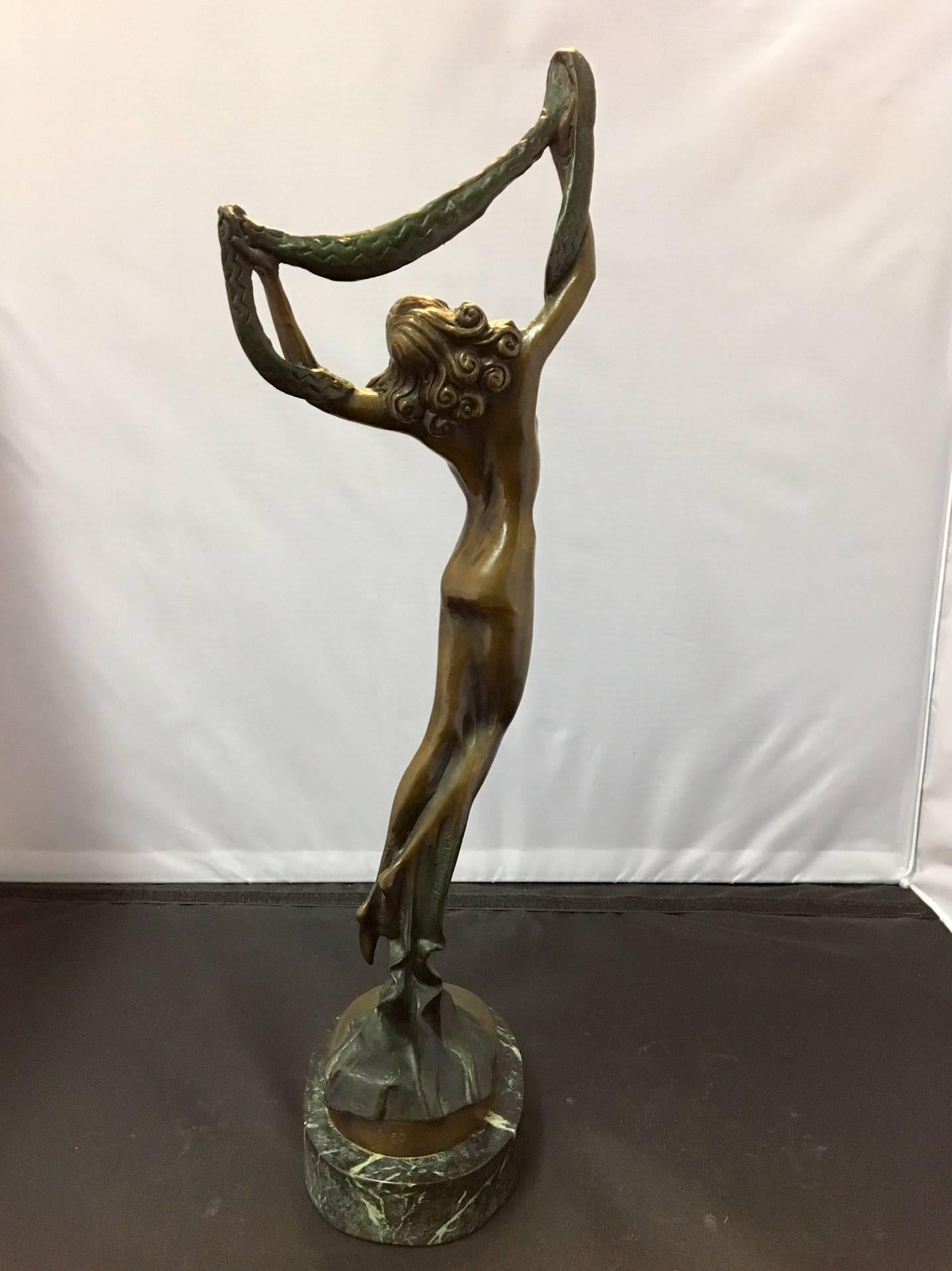 Wonderful bronze statue of a nude dancer on a marble base. This statue is an estate find and is signed D.H. Chiparus. There are also several other markings that I cannot distinguish (see pictures) and it is stamped 5/50. The piece has a great patina