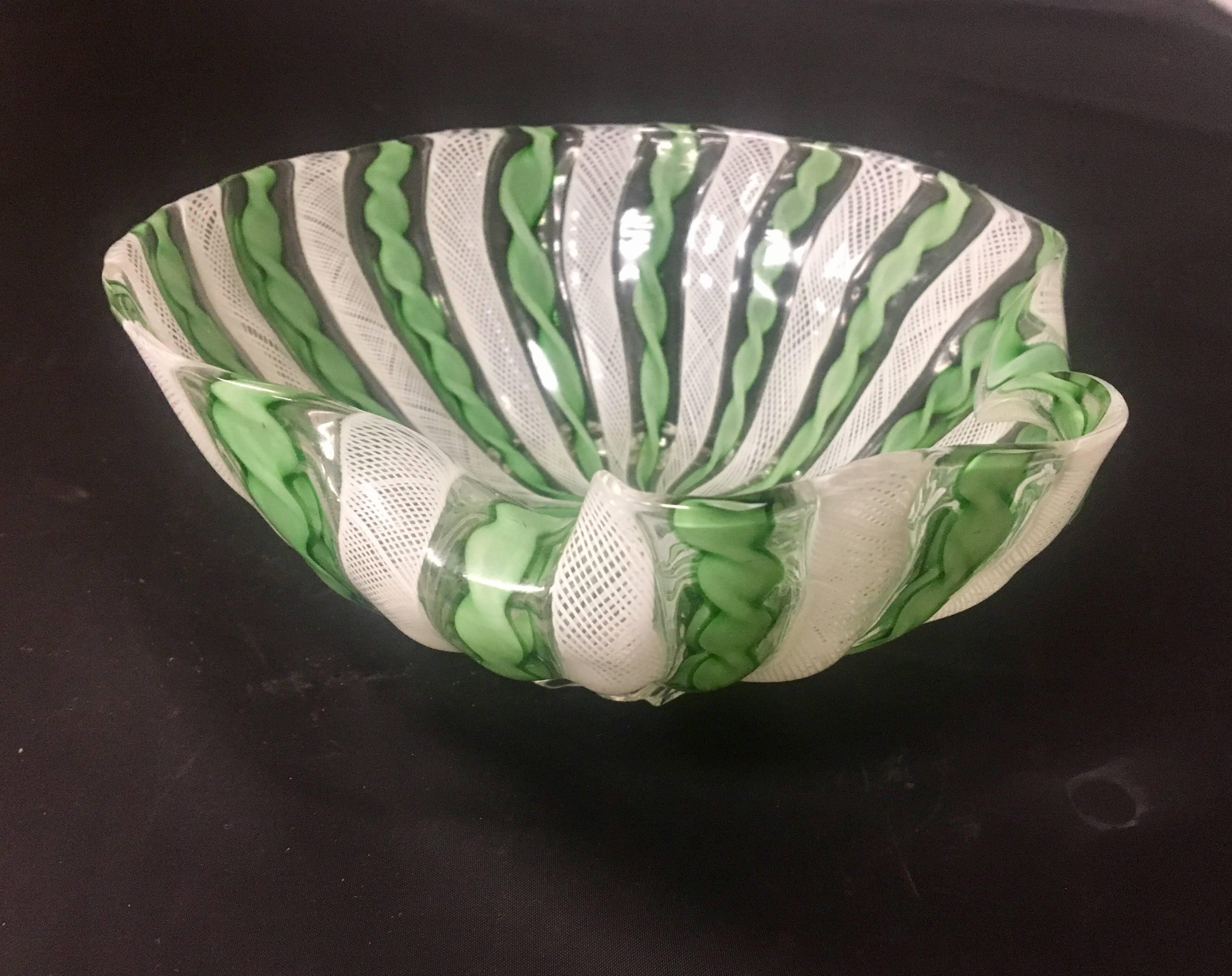 Beautiful Murano Venitian glass bowl with footed base. Excellent condition, no chips or cracks; retains its original label. Green, clear and white color combination.