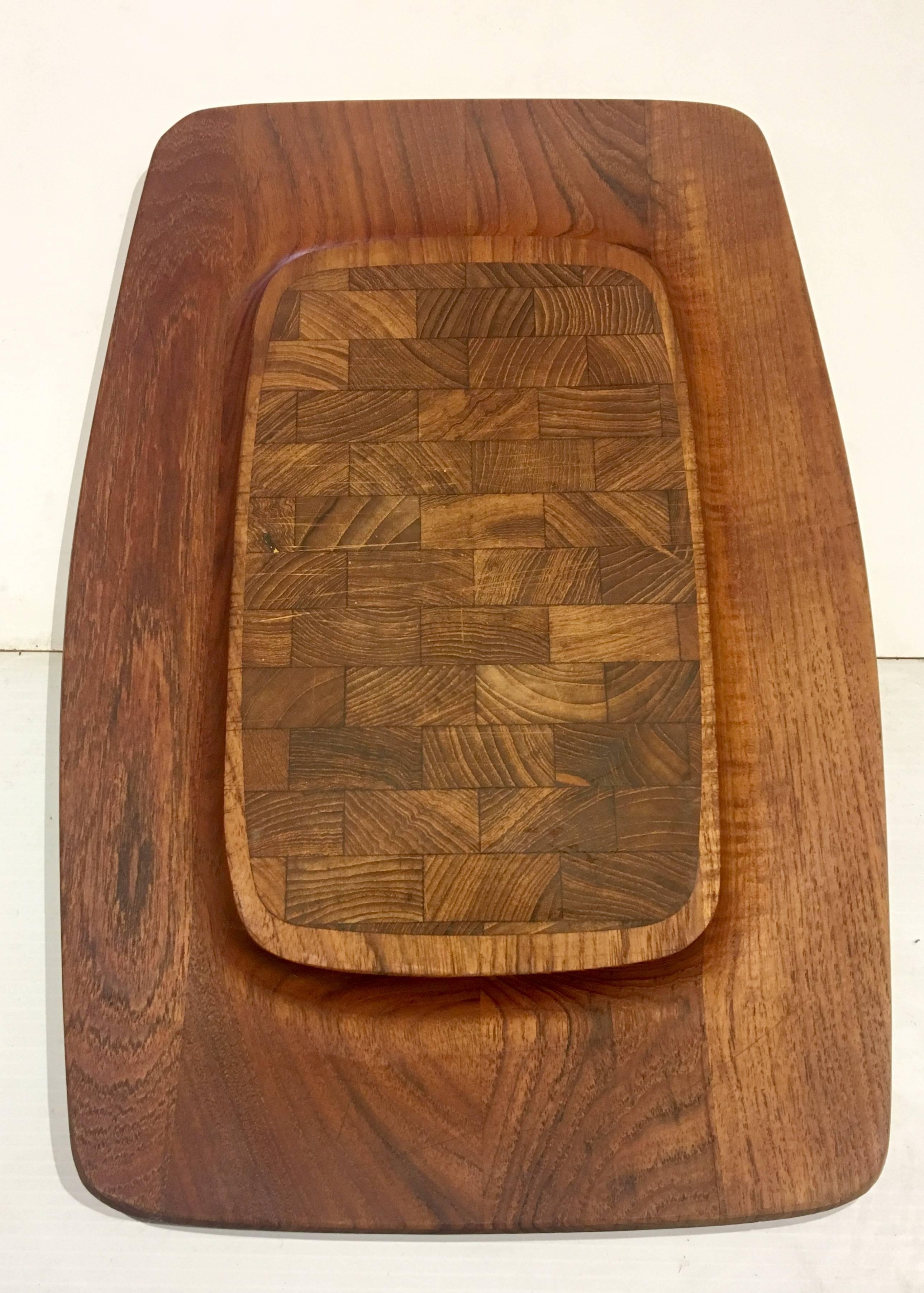 Great design on this solid teak tray designed by Quistgaard for Dansk, circa 1950s raised edge , and butcher block center great condition. Early production Made in Denmark.