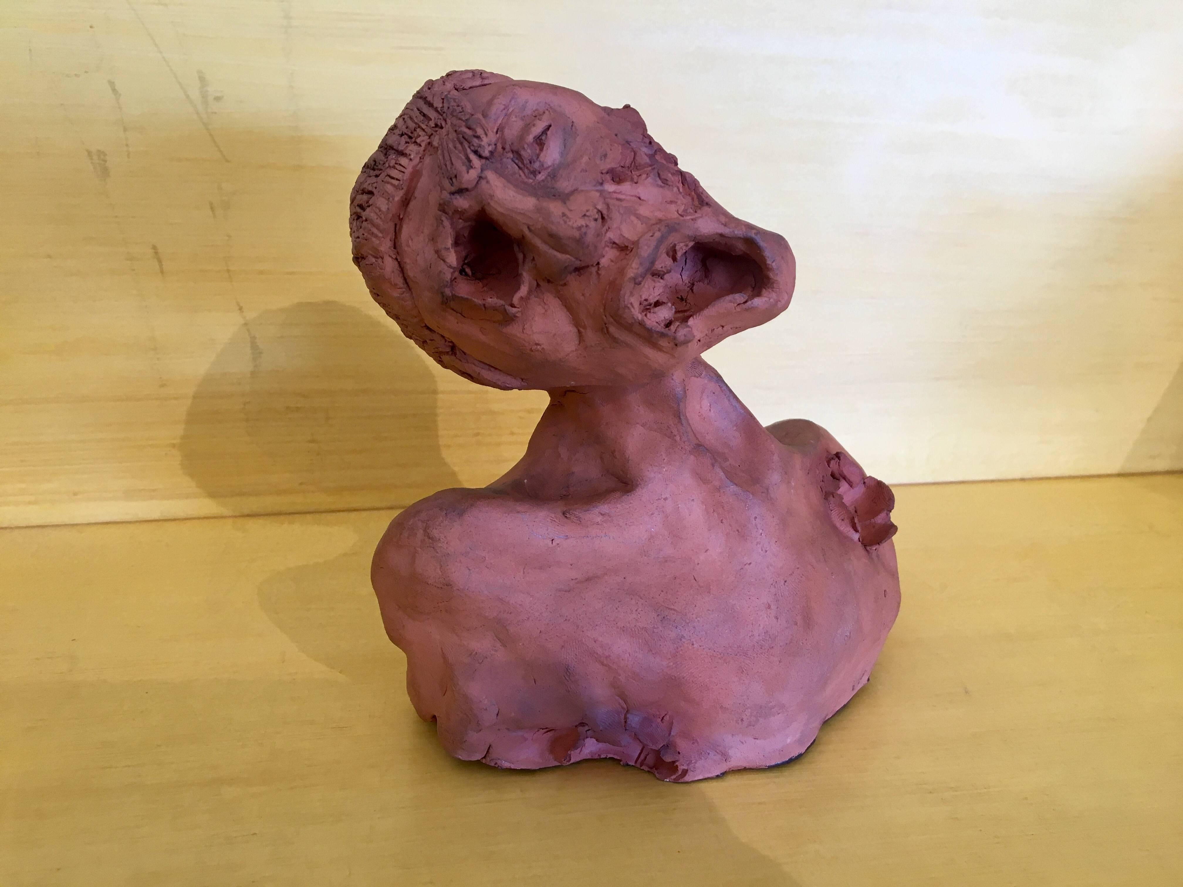 This writhing human figure may have been a student creation. Signed by J.W., the contorted open mouth complete with teeth and tongue are very well done. One can almost feel his pain and anguish. 6" H.