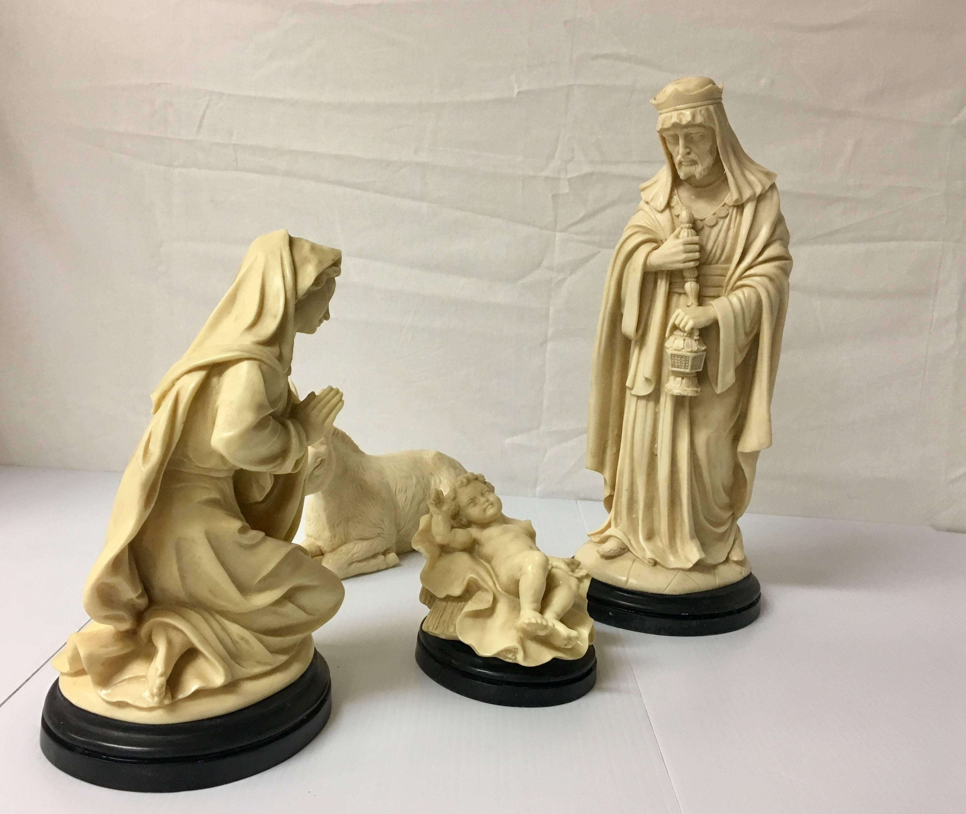 Gorgeous Italian hand-carved, figurative nativity set signed by G. Ruggeri. Each piece is stamped Bianchi and carved from alabaster colored resin with a nice beveled black base. The set comes with 9 figures (pictures show only 8, there is also a