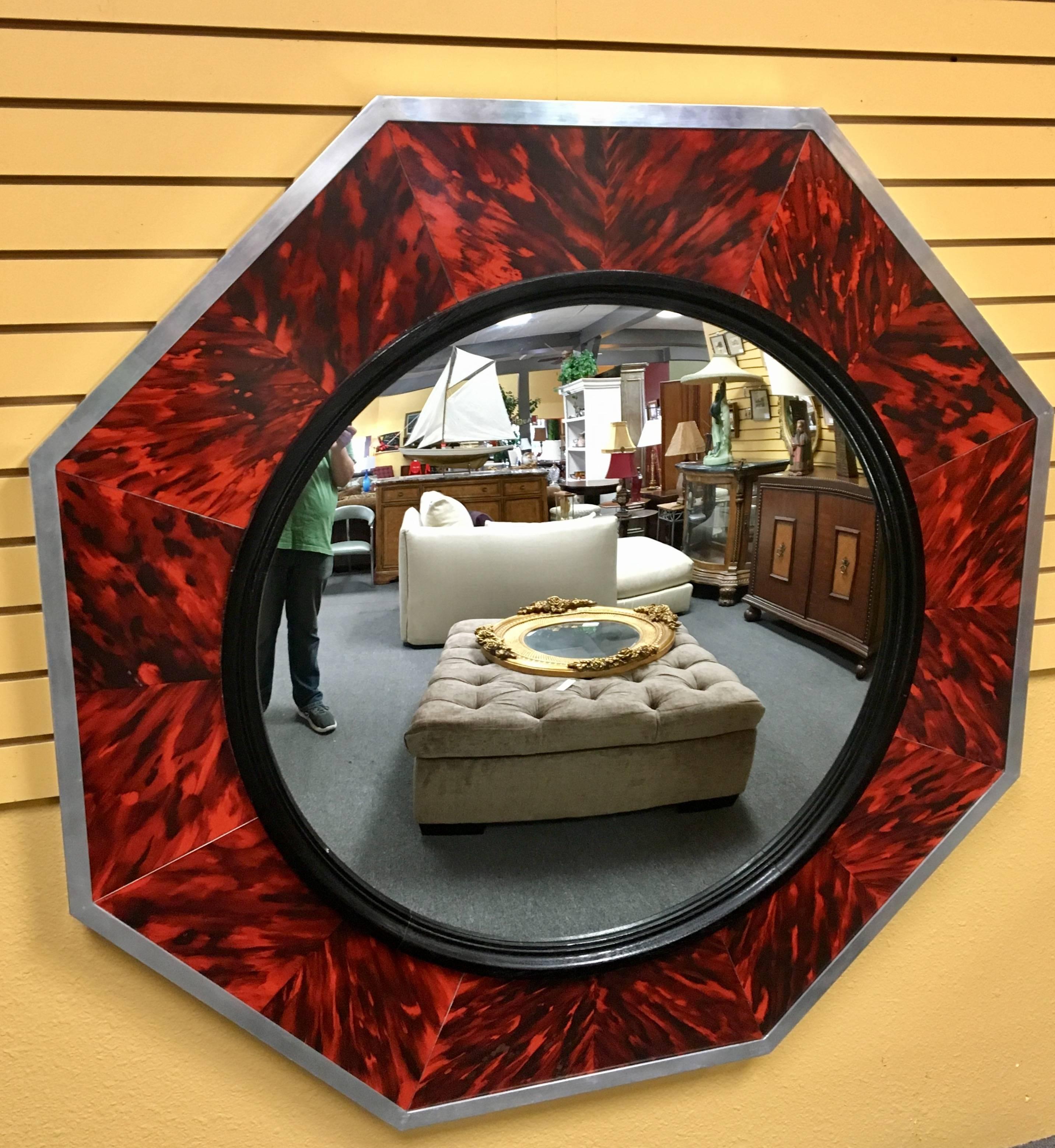 Impressive large mirror with concave center in a faux tortoise shell decorative frame with polished aluminum edge by Anthony Redmile London (stamped on the top) Purchased in England in the 1970s.