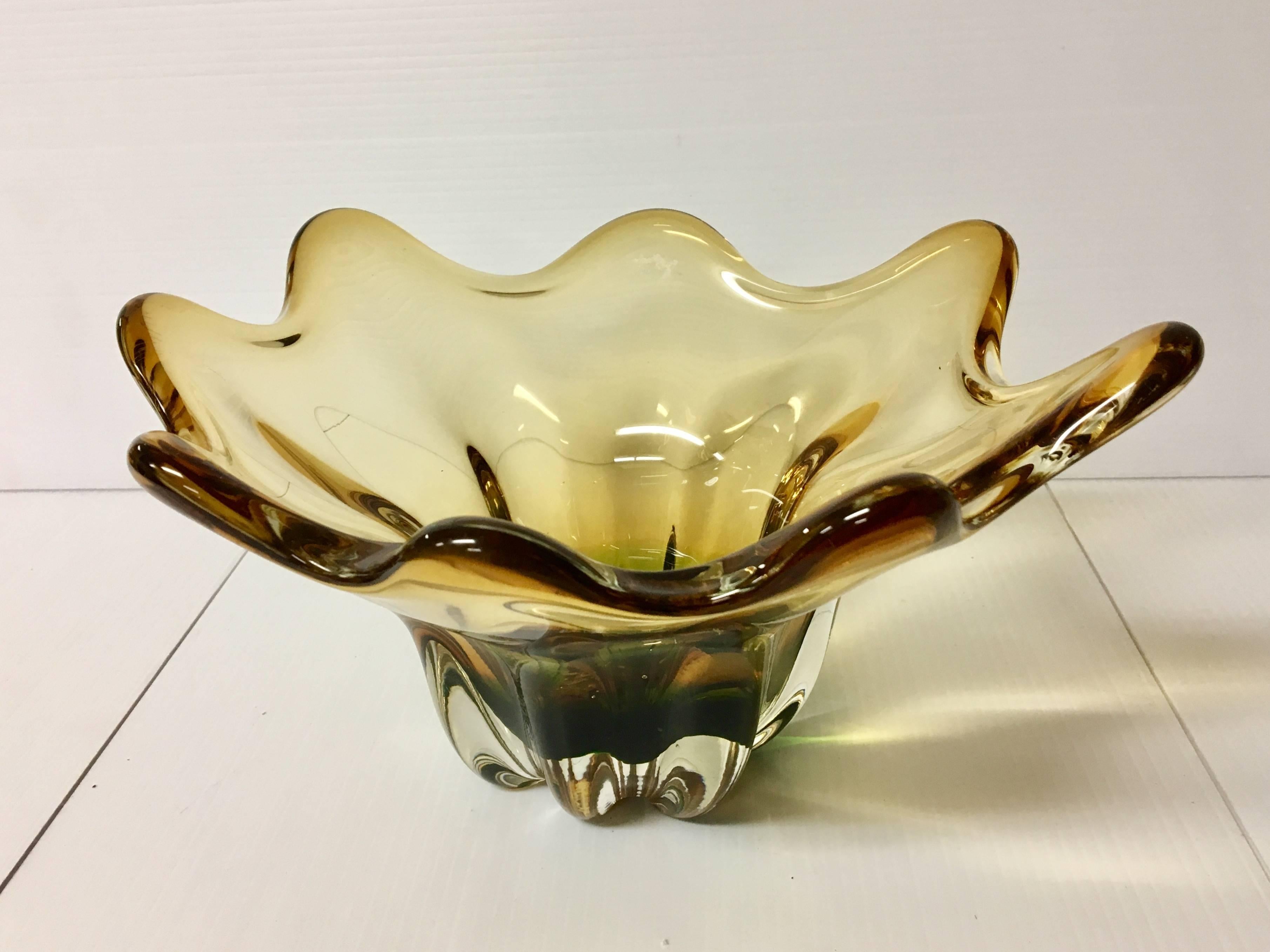Beautiful free-form candy bowl dish in green and gold Murano glass, circa 1950s. Excellent condition no chips or cracks.