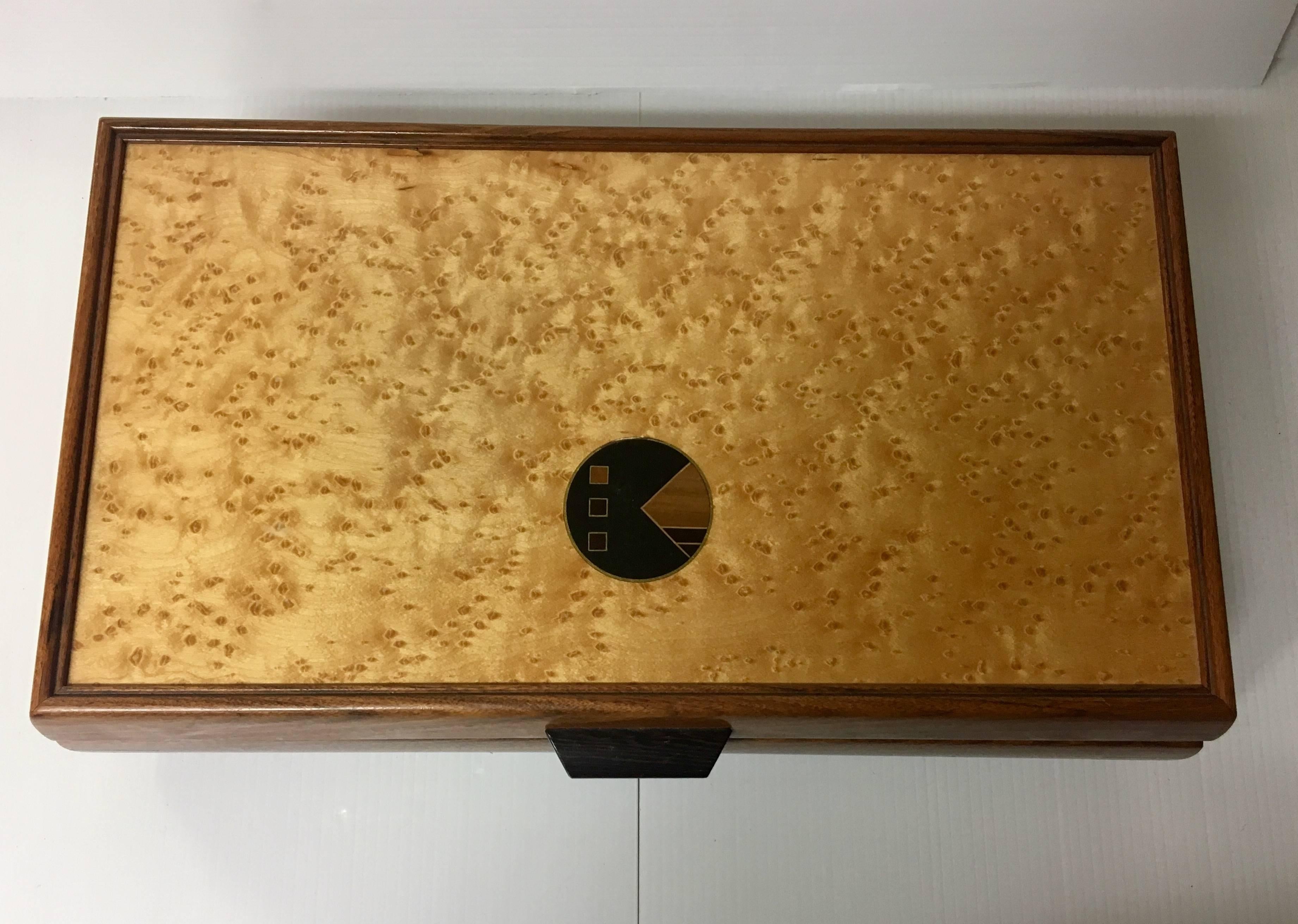 Beautiful and unique handcrafted jewelry box made of inlaid mixed woods (mahogany, walnut, burl wood, rosewood) and brass. The piece is handmade and has lots of storage and compartments.