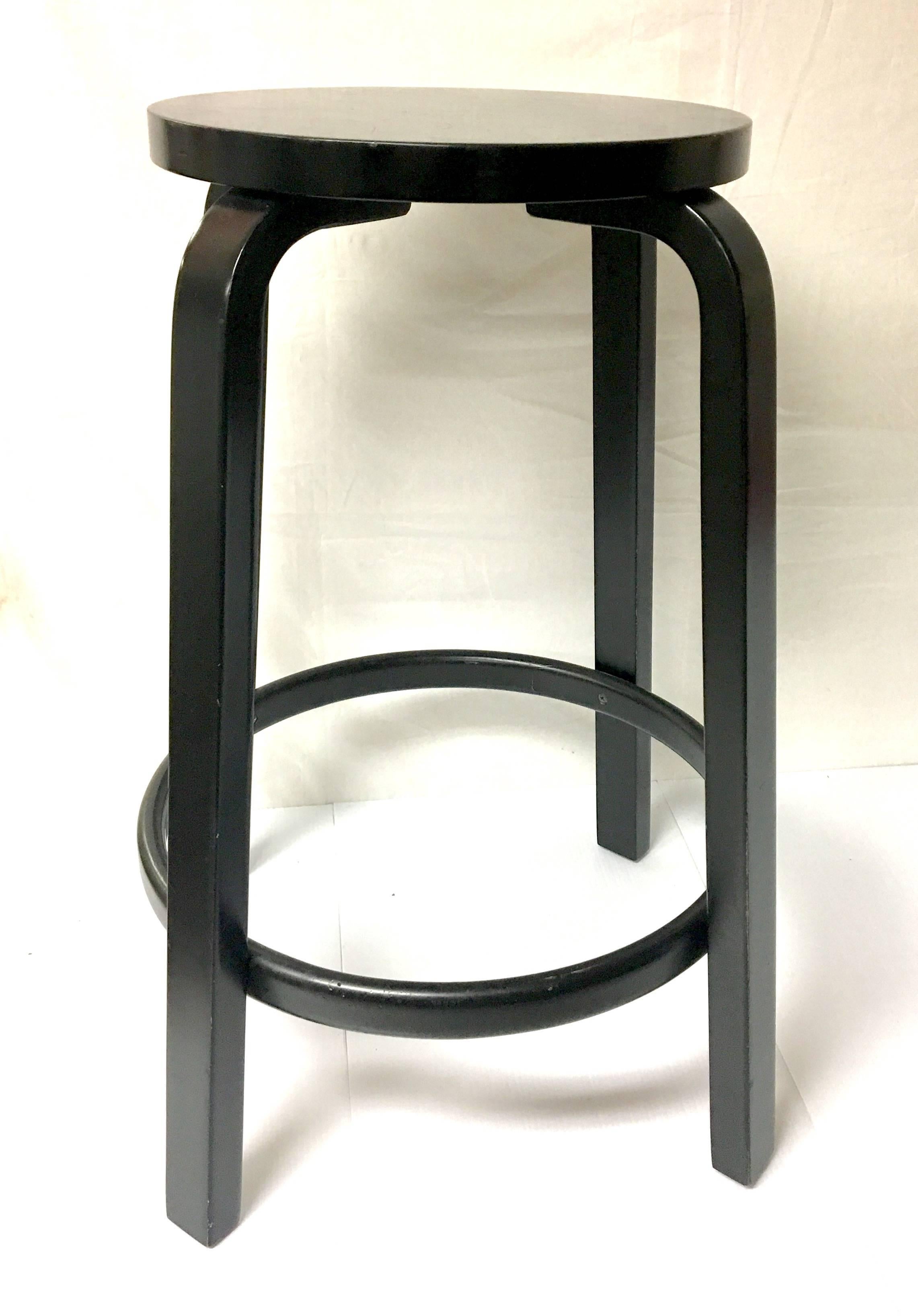 Pair of  counter stools designed by Alvar Aalto for Artek, solid and sturdy frames with original worn finish , shows wear and chips sold AS/IS, each stool comes with its original rubber feet. Buyer can buy 1 or 2