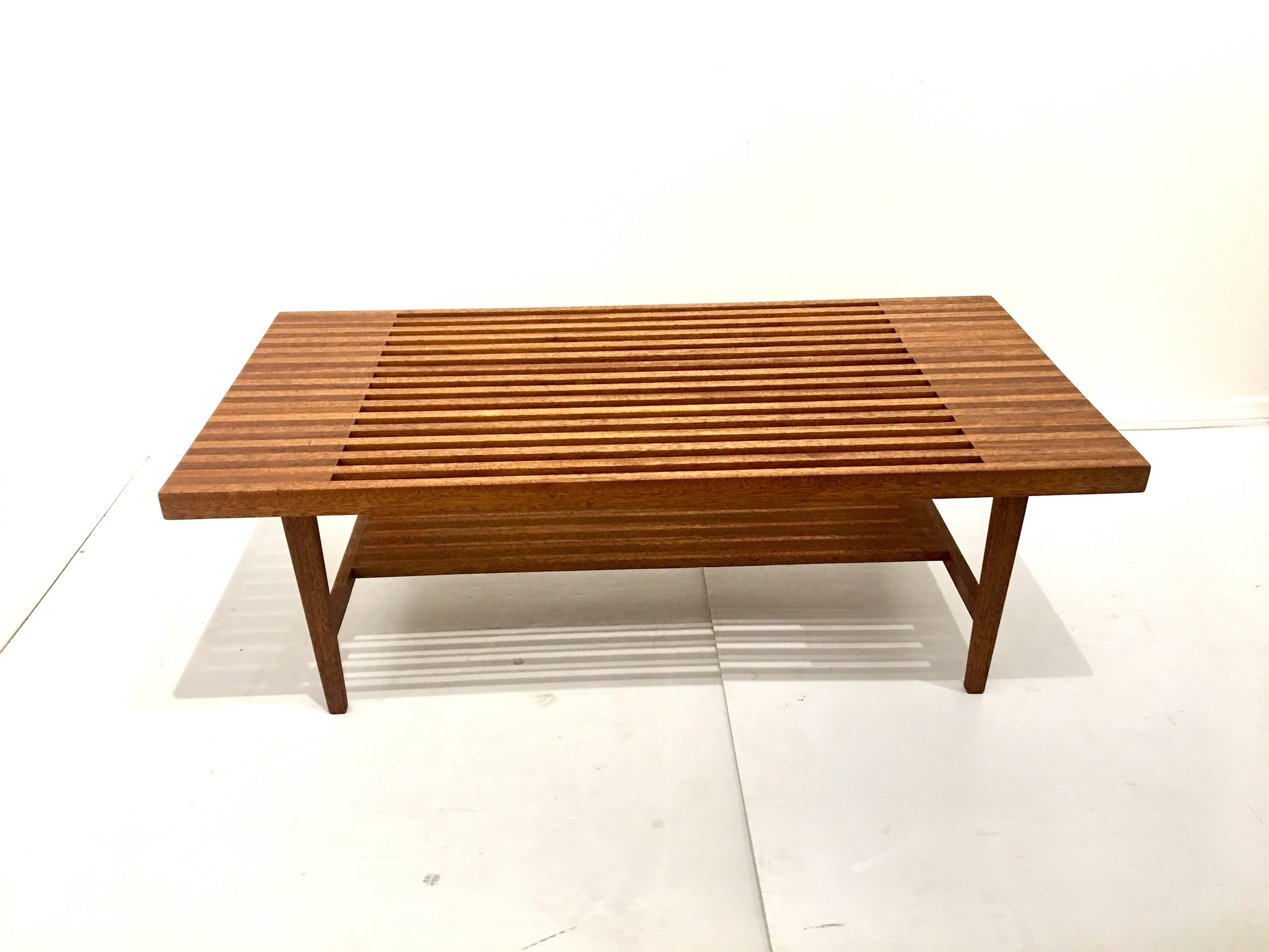 Striking solid mahogany slat bench / coffee table , in the style of Brown Saltman, solid and sturdy incredible craftsmanship and quality, freshly refinished one of a kind piece.
